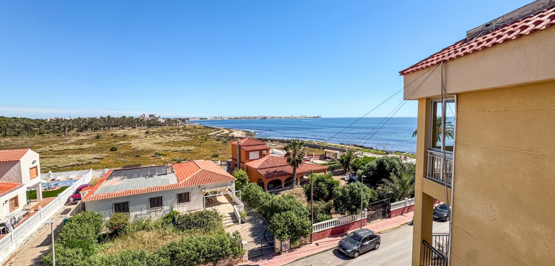 This beautifully renovated top-floor apartment in Punta Prima offers a rare opportunity to enjoy modern Mediterranean living only 50 metres from the sea. Located on the third and highest floor of the building, the property enjoys stunning sea views from both the living room and bedroom, creating the perfect coastal atmosphere on the Costa Blanca.The apartment features one spacious bedroom, one stylish modern bathroom, and a bright open-plan kitchen seamlessly connected to the living area, creating an airy and contemporary space filled with natural light. Both the bedroom and living room offer relaxing views of the Mediterranean Sea.The property has recently undergone a complete high-quality renovation, where everything has been renewed — from electrical wiring and plumbing to appliances, kitchen, bathroom, and interior finishes. The kitchen also includes an integrated washing machine for added practicality and convenience. Sold fully furnished, the apartment is completely move-in ready.Additional features include air conditioning and a desirable northeast orientation that keeps the property bright and comfortable throughout the year.Ideally situated only around 100 metres from the renowned Nautilus restaurant and within walking distance to beaches, the promenade, shops, and all amenities, this apartment is an outstanding opportunity as a holiday home, rental investment, or stylish seaside residence.