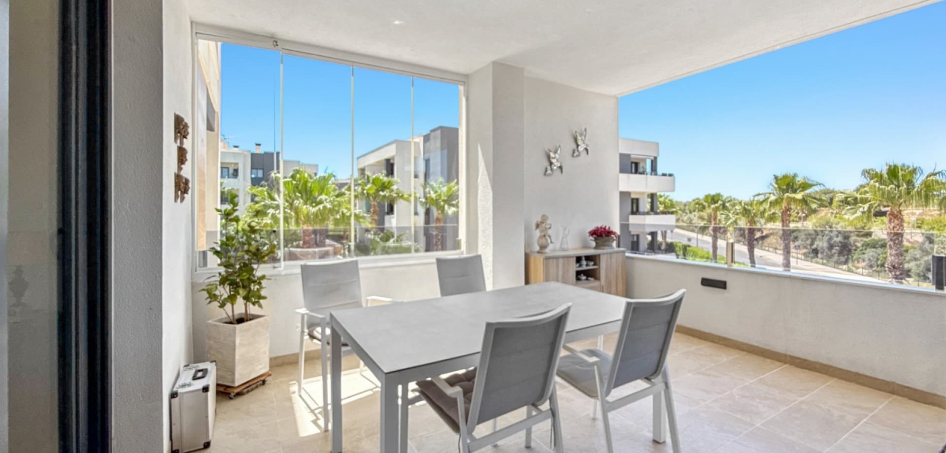 Welcome to this stylish and modern second-floor apartment located in the highly sought-after residential complex of Los Altos. Situated in the exclusive Amanecer VI community, this beautifully presented property offers contemporary comfort, excellent outdoor spaces, and access to outstanding communal facilities in one of the Costa Blanca’s most popular areas.The apartment features two spacious bedrooms and two modern bathrooms, making it ideal as a permanent residence, holiday home, or investment property. The bright and airy open-plan living and dining area connects seamlessly with the modern kitchen, creating a comfortable and social atmosphere perfect for both relaxing and entertaining.Thanks to its desirable south-facing orientation, the property enjoys plenty of natural sunlight throughout the day, creating a warm and inviting ambiance all year round. From the living area, you have direct access to a lovely terrace where you can enjoy the Mediterranean climate, outdoor dining, or simply unwind in the sun.The gated Amanecer VI community is known for its beautifully maintained green areas and impressive communal swimming pool, offering a peaceful and luxurious environment for residents. The property also includes a private underground parking space and a storage room, adding both convenience and practicality.Located close to shops, restaurants, golf courses, and the beautiful beaches of Orihuela Costa, this apartment combines modern living with an excellent location on the Costa Blanca.