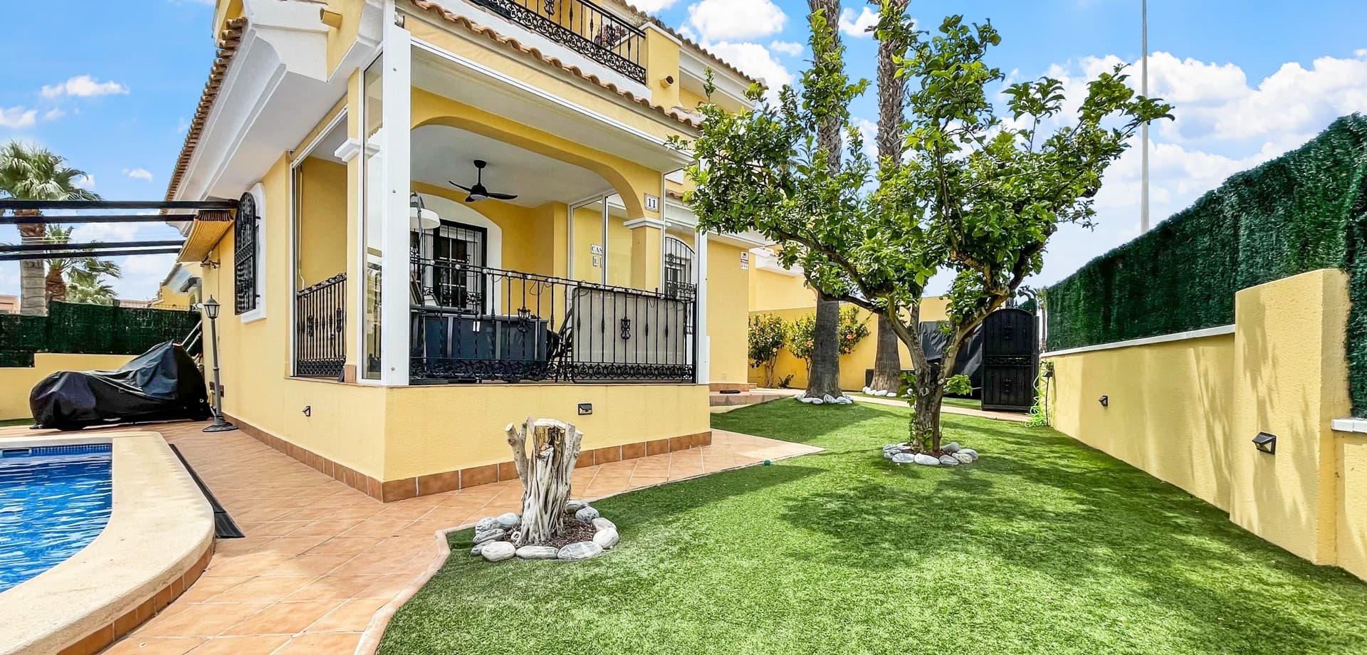 Located in one of the most desirable areas of Los Dolses, Orihuela Costa, this beautifully maintained detached villa offers an outstanding combination of privacy, comfort, and an unbeatable location. Positioned on a prime corner plot with access from both a private road and the main street, the property enjoys one of the best locations within the urbanisation.From the moment you arrive, it is clear that this home has been meticulously cared for. The villa is presented in excellent condition and is ready to move into immediately, making it an ideal permanent residence, holiday home, or investment property on the Costa Blanca.The outdoor areas have been designed for enjoying the Mediterranean lifestyle to the fullest. A stunning private swimming pool, recently upgraded with new LED lighting and refreshed finishes, forms the centrepiece of the garden. The beautifully landscaped plot was redesigned approximately five years ago and offers a perfect balance of sunshine, privacy, and relaxation. Residents also benefit from access to a communal swimming pool within the urbanisation.The main terrace has been enhanced with glazing and sun awnings, creating a versatile space that can be enjoyed throughout the year. A covered pergola provides convenient private parking within the plot.Inside, the villa offers bright and welcoming living spaces complemented by recently installed Panasonic air conditioning units with heating and cooling functions throughout the property. A new water heater, utility area, laundry space, pantry, and a large wooden storage house within the garden further enhance the practicality of the home.The property is sold fully furnished, allowing the new owners to move in and start enjoying their new lifestyle immediately.One of the villa’s greatest advantages is its strategic location. La Zenia Boulevard shopping centre can be reached in approximately 15 minutes on foot, while restaurants, supermarkets, cafés, and everyday amenities are just a short walk away. Several renowned golf courses are also within easy reach.The area continues to benefit from significant investment and future growth, with the new hospital and commercial area currently under construction nearby, as well as the future Orihuela II Health Centre. Excellent transport connections provide immediate access to the AP-7 motorway and convenient links to the AVE high-speed rail station in Orihuela.Combining a prime corner plot, private swimming pool, immaculate condition, and one of the most sought-after locations in Orihuela Costa, this exceptional villa represents a rare opportunity in the heart of Los Dolses.