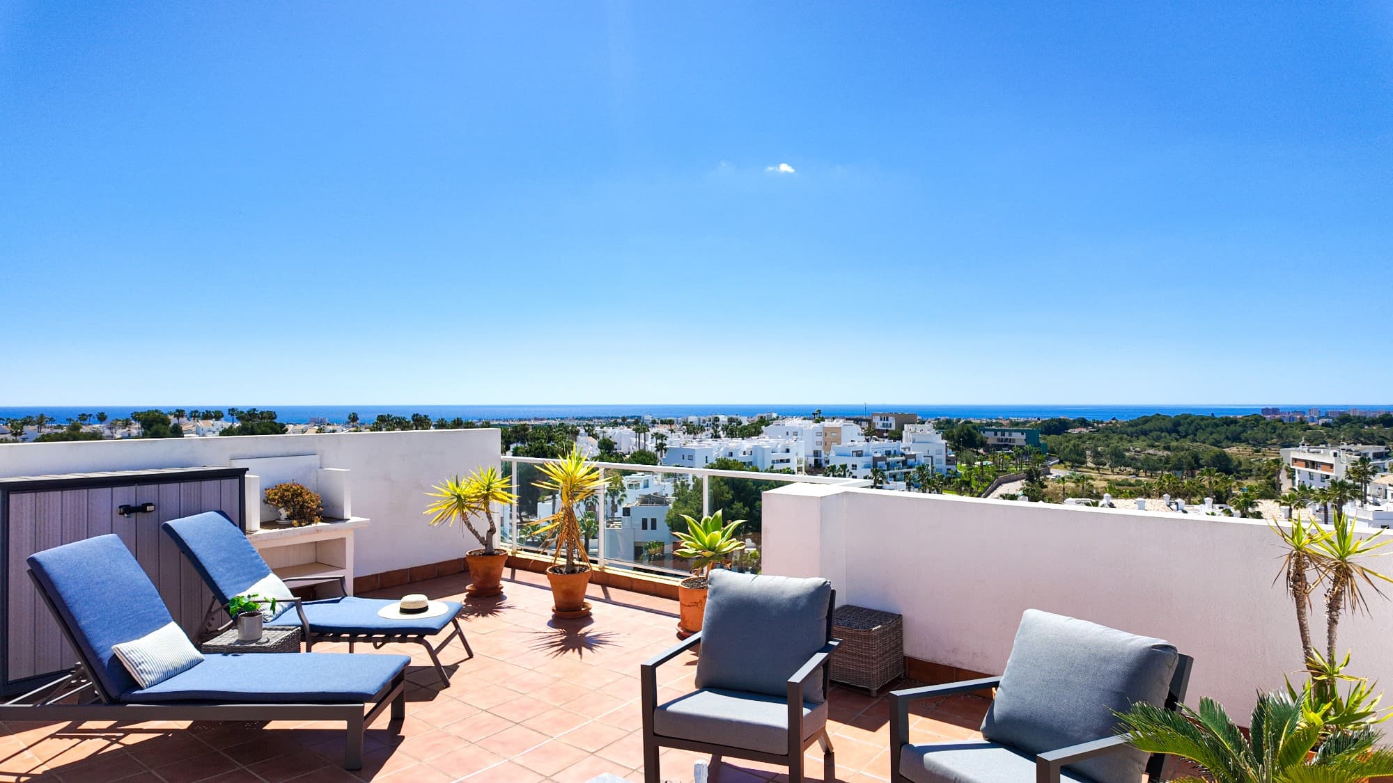 The first thing that truly captures the feeling of this home is the light and the view. The apartment benefits from natural light from two directions, creating a bright and welcoming atmosphere. From the balcony, you enjoy fantastic views over the area and the Mediterranean Sea. On clear days, you can see all the way to La Manga on the horizon, giving the property a very special character. The owners themselves say that “we practically live on the balcony”. And yes – the views become even more impressive from the private rooftop terrace, where the panoramic scenery stretches in both directions along the coastline, all the way to Santa Pola.The layout is both practical and social, perfect for two people or for hosting family and friends. The two bedrooms are complemented by two bathrooms, making everyday life extra comfortable. The modern kitchen also features an extendable dining table that easily seats up to six people.The property is centrally located while still offering a peaceful setting, with walking distance to everything you need. In just around five minutes on foot, you reach Centro Comercial Las Fuentes – a charming and lively area filled with restaurants, cafés, bars, shops, and services. It’s the perfect place to enjoy long lunches in the sun, spontaneous dinners with friends, or simply stroll around and enjoy the atmosphere all year round.For golf lovers, the location is ideal, with both Las Ramblas Golf and Campoamor Golf only around 5 minutes away by car. The beautiful beaches of Cabo Roig can be reached in approximately 10 minutes.Despite its central location, the area feels very calm and harmonious. One detail the owners especially appreciate is the quiet surroundings – no barking dogs or disturbing noise from neighbours.This is an international yet welcoming community with mainly Belgian and Scandinavian residents. The closest neighbours are Norwegian and Swedish, creating a safe and familiar atmosphere for many Nordic buyers.The property also includes a spacious parking space in a secure garage, something that is highly valued all year round. A safe is installed in the apartment, and the community allows rentals, making this an excellent option both as a permanent residence and as an investment property.