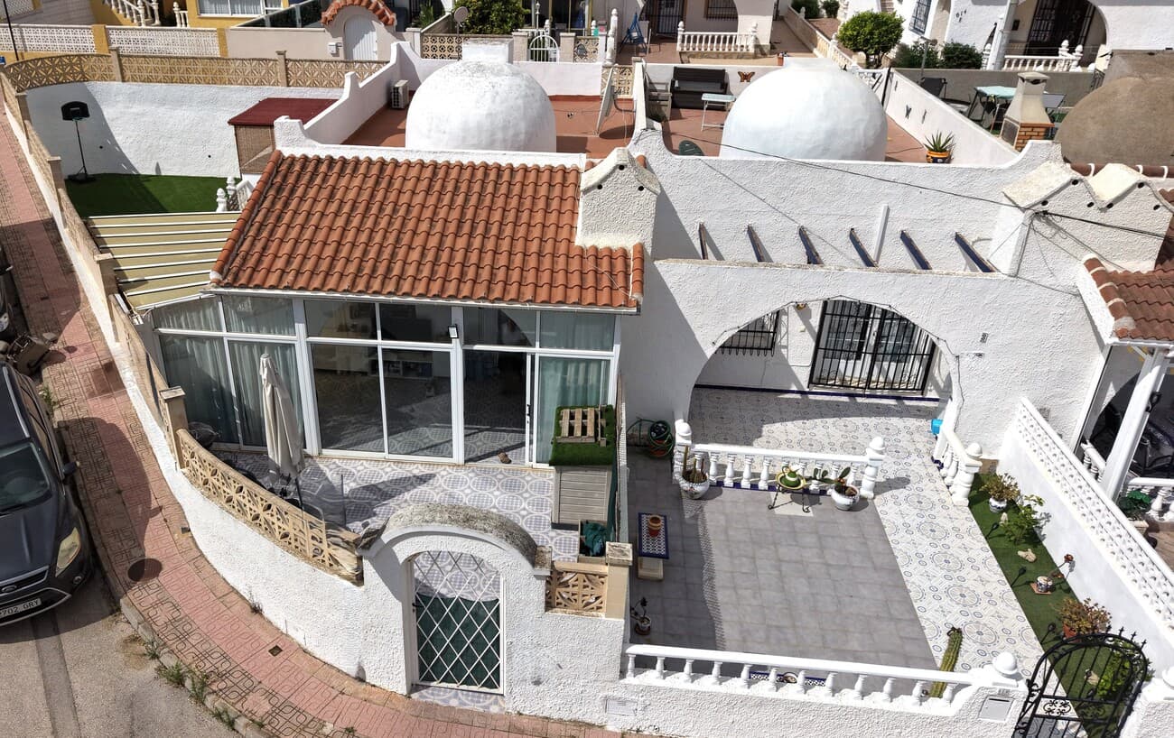  We present this Gem of a Bungalow, a one level house, with 2 Bedrooms,  Sun Room & Roof Solarium, in the sought after location of Blue Lagoon!Located just a 2 min walk to the first few bars! and 3 mins to the 24/7 mini market - 10 min walk to Villamartin Plaza Externally:You have a small front garden, North East Facing, ideal to escape the Sun on these hot days! BUT the lovely rear garden, is South East Facing, atlhough a Sun trap for those who love the Sun, there is a fantastic snug area, where you can chill out and enjoy the summer without being in that direct heat. or perhaps you'd turn this into a Bar! Also as you'll see in the photos, there is an area of Good Quality Artificial Grass area  Whilst there is no pool, look at our drone footage, to see what other neighbours have done. In the rear garden, if you were to open up the Ballastrades, making one area, this garden would transform in size and give room for a full size pool or a smaller plunge pool (very approx cost is anything from €12-20,000 *depending on so many factors) Roof Solarium - for the real Sun worshipers, or, to catch a better winter sun. Entering the property:As you enter, you're walking into a Glazed Terrace area. Perfect for sitting in from the Sun and ideal for winter, outside living away from the chill. This area, could easily, subject to planning permissions, be extended, to use as additional inside space, extending the kitchen & Lounge area and still at the side, you could have that remain as an indoor area, so not loosing that ability to have a sun room. Walking into the house, you're entering the Double Glazed French doors, open plan, Lounge, Kitchen, dinning area.The Kitchen is spacious and modern, with a side door to the rear Garden. The Lounge has Air conditioning. To the rear of the lounge you have the Master Bedroom,  with Airconditioning unit. 2nd Bedroom and Bathroom. Community fees: €130 a year (as no pool or Gardens)IBI - SUMA €319.42 (Council tax) LOCATION: Blue Lagoon is a sought after area for a few reasons. Lots of Bungalows, for people that prefer, one level living. Also, it's so close to everything.5 minutes to Padel courts - 5 minutes to Greenlands Mini golfJust 2 minutes walk, you have a few local Bars and restaurants, including 5 mins away, Bar 22 and RJ's *formally Captain Morgans3 mins walk to the  24/7 mini market 10 min walk to Villamartin Plaza5 mins walk to the Bars of Sliders, Boris's (great for playing pool or Darts, Tv's for Sports) and many other Bar. Restaurants include, 2 Chinese, 1 Indian and the Fabulous Greek Tavern!There are also 4 Championship Golf Courses within a few minutes drive of the property, with Villamartin being the closestThere is a long canal that runs through Las Ramblas to areas such as Villamartin, San Miguel De Salinas. Ideal to walk to locations and also a great Cycling routeLa Fuente is a commercial area, full of Shops, Bars & Restaurants. You will also find the supermarkets of Aldi and Mercadona. This is all a 2 minute drive from the property.La Zenia Boulevard, housing over 150 shops, Bars & Restaurants is just a 5 minute drive away!The Stunning Beaches of Costa Blanca are on your doorstep! less than 8 minutes drive this property will have a video soon added soon 