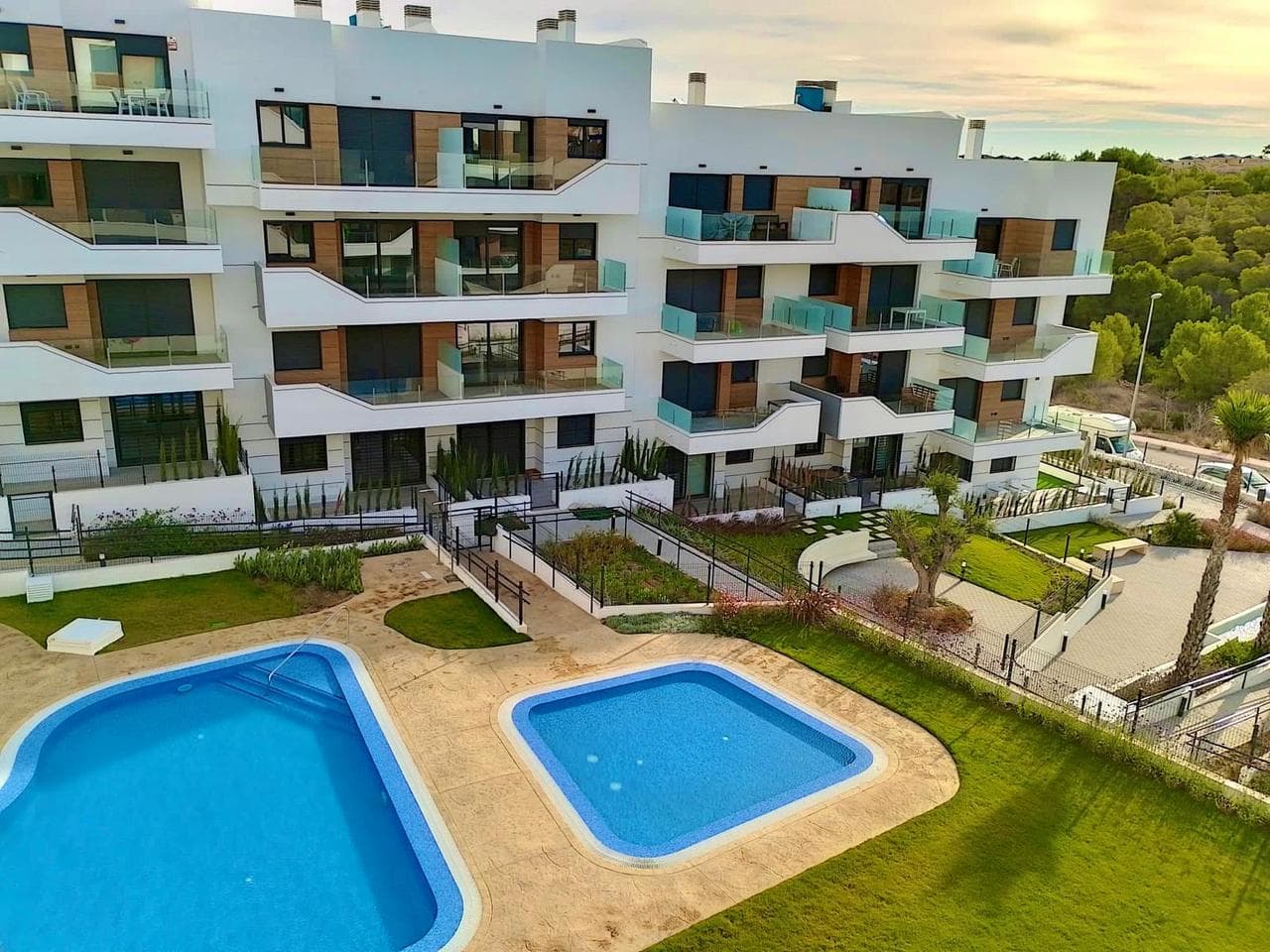 Modern luxury second floor apartment with 2 bedrooms in Villamartin, Alicante with beautiful communal gardens and swimming pools.The apartment will be sold fully furnished and consists of a spacious bright living/dining room, a modern fully equipped open plan kitchen, two bedrooms with fitted wardrobes, two bathrooms (one is en-suite), air conditioning (hot/cold) throughout the property, intercom connected to the two pedestrian entrances to the residential complex included, and an allocated parking space in the garage.The communal areas are roughly 4.400sqm big and there are two swimming pools, jacuzzi, children's playground, and 2 petanque courts. Wi-Fi will be available in all communal areas.Designed to fulfil the needs of those who are looking for the Mediterranean lifestyle, in a quiet are in a quiet but well established area and yet close to the sea (8 minutes) and very close to all amenities. The gated community has a total of 94 units.