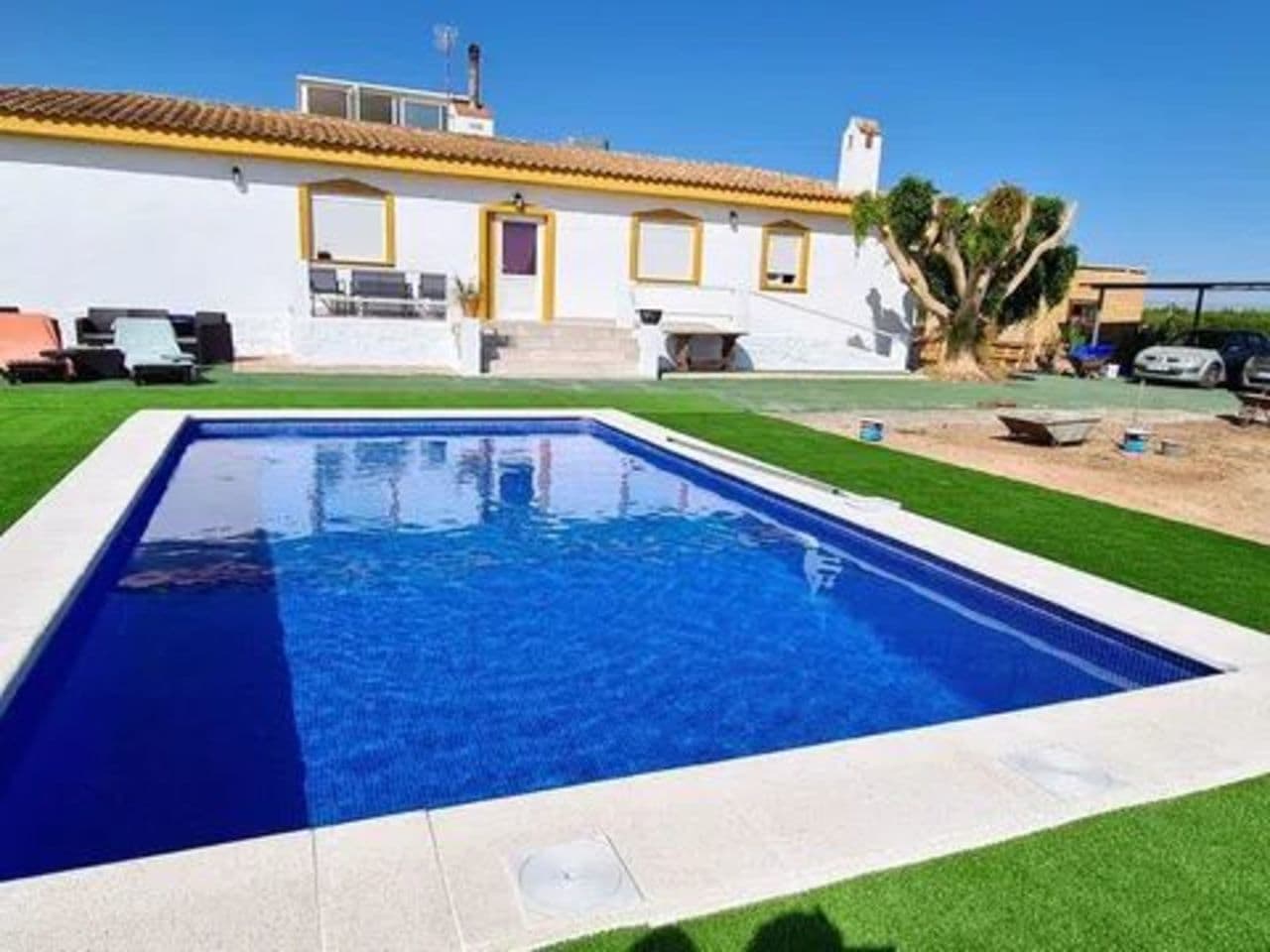 Spectacular newly renovated 6 bedroom villa of 340sqm, built on a plot of 12.170sqm situated in San Miguel de Salinas, Alicante.All on the ground floor: very large living room with open kitchen, six large bedrooms and three bathrooms. Behind the house there is another patio of 74sqm completely covered. Next to the terrace is the swimming pool, which is surrounded by the garden on both sides. In the garden there is also a storage shed and a garage for two cars. Around the house there is still extremely fertile land that is completely fenced. Very ecological, own electricity supply via solar panels.