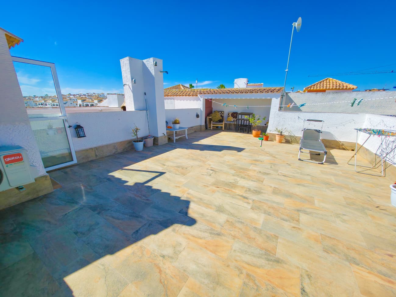 Introducing a dream opportunity for sun seekers and golf enthusiasts alike: this South facing, superbly presented upper floor apartment in the highly desirable Entre Naranjos - Vistabella Golf, ideally located just a few minutes drive from nearby San Miguel de Salinas. Flooded with natural sunlight all day, the residence radiates a sense of warmth and contemporary luxury, creating the perfect haven for those who cherish vibrant living spaces and sunny days.Step inside to discover an expansive living area, fully equipped with air conditioning for year-round comfort, and a stylish kitchen set to the rear. Patio doors open onto a glazed terrace, a sun-drenched retreat ideal for al fresco dining, basking in the golden Spanish sun, or simply unwinding with breathtaking views. Imagine mornings sipping coffee as sunlight pours in, or relaxing after a round on the golf course under clear blue skies.There are two inviting double bedrooms, both featuring fitted wardrobes for ample storage, with the master bedroom also enjoying air conditioning, ensuring restful nights after sun-soaked days outdoors. The family bathroom, boasting a newly installed walk-in shower, sits conveniently between the bedrooms, providing modern comfort for guests and residents.The crowning glory of this apartment is the private solarium, accessed from the terrace by internal stairs. Here, soak up panoramic views of the lush surroundings, perfect for sunbathing, outdoor BBQs, or simply relaxing after a day on the greens. It even has a storage room for the chairs and loungers. The beautifully tiled solarium welcomes you to indulge in endless sunny afternoons, with space for entertaining or tranquil moments alone. Some furniture is included for a seamless move-in experience.Residents are spoiled with exclusive access to a sparkling communal pool and manicured gardens—just steps from your door—while community fees remain attractively low, making this a smart and accessible investment. The communal areas offer a peaceful oasis for cooling off between rounds of golf or meeting friends for a leisurely afternoon.Ready for immediate occupation, this apartment is ideal as a holiday home, a permanent residence, or a lucrative rental investment. Immaculately maintained, it ensures you can dive straight into your new lifestyle, whether you're chasing the sunshine or teeing off at dawn.Location is everything: indulge in the vibrant local scene, with bars, restaurants, shops, a pharmacy, coffee shops, beauty salons, gym, and supermarket all within walking distance. Most importantly, the renowned Vistabella Golf Resort awaits nearby, offering a scenic golf course, driving range, putting area, padel courts, bowls, and the acclaimed Terrazas Bar and Restaurant. Golf lovers will delight in the convenience of world-class facilities right on their doorstep.Homes of this calibre and in such a sunny, golf-friendly setting are extremely sought-after and rarely available. Don’t miss your chance—arrange your viewing today, in person or via video, and begin living your sun-filled lifestyle!