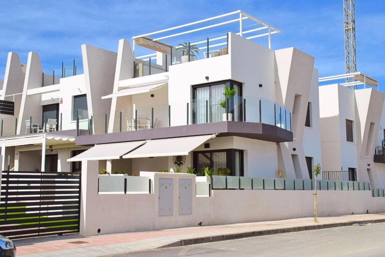 Luxury South-Facing Corner Penthouse with Exceptional Solarium & Panoramic ViewsWe are delighted to present this stunning south-facing corner penthouse apartment in San Miguel de Salinas, offering uninterrupted views across the Torrevieja Salt Lakes and towards the historic castle beyond. Overlooking the beautifully maintained communal pool and gardens, this modern home — built in 2024 — has been uniquely designed to maximise both indoor comfort and exceptional outdoor living.Ideally situated close to all local amenities, this penthouse immediately stands out thanks to its exclusive corner layout, unlike any other property within the development. Its elevated position, expansive windows, and south-facing orientation fill the home with natural light throughout the day, creating a bright and welcoming atmosphere.Inside, the apartment features a bespoke open-plan kitchen, dining, and living area, carefully designed to provide a stylish, spacious, and contemporary feel. There are two generous double bedrooms, both with built-in wardrobes, along with two modern shower rooms, including a beautifully finished en-suite to the master bedroom.The living area flows seamlessly onto a spacious 24.53m² wraparound terrace, which leads to the impressive 79.08m² private rooftop solarium. Designed with no expense spared, this outstanding outdoor space is perfect for relaxing, entertaining, dining, or simply enjoying the spectacular panoramic views.Residents benefit from excellent communal facilities including a large swimming pool and children’s play area, ideal for families or those seeking a relaxed resort-style lifestyle. Additional features include air conditioning, electric shutters, and fly screens, ensuring year-round comfort and convenience.This is a rare opportunity to own a high-quality, uniquely designed penthouse with exceptional outdoor space and some of the finest views in the area.Furniture is also available by separate negotiation.