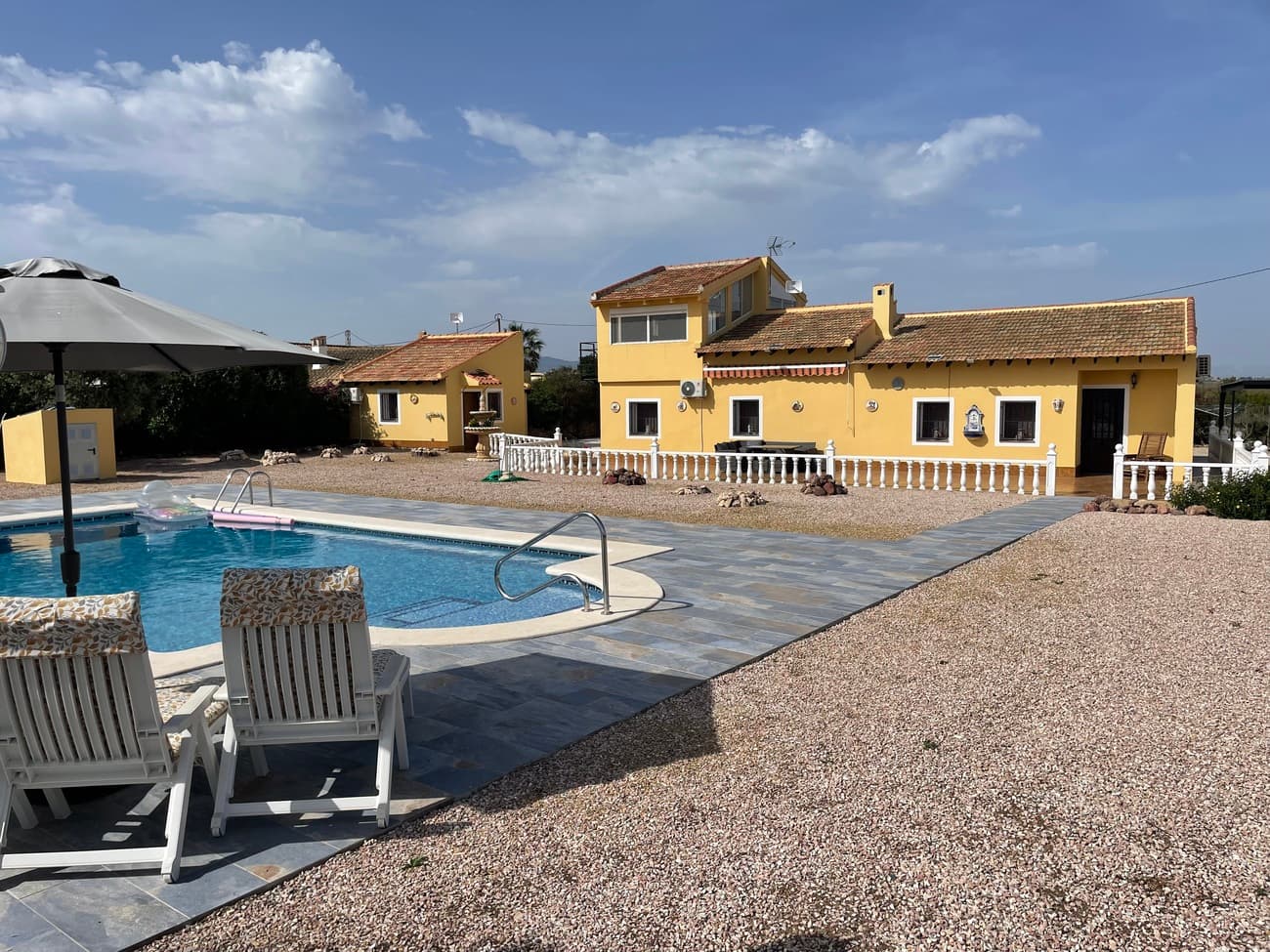 Stunning 5 bed, 3 bath country villa with two independent guest accommodations in Alhama de Murcia.  With a private 9 x 5 swimming pool, fireplace, A/C, large plot and wonderful views, viewing is highly recommended!This exceptional country villa offers an elegant blend of space, privacy, and Mediterranean charm. Set on a generous plot in the peaceful outskirts of Alhama de Murcia, the property presents beautifully maintained interiors, mature gardens, and multiple outdoor living areas designed for year‑round enjoyment.The main residence features 3 well‑proportioned bedrooms, one stylish bathroom, a bright and spacious living area, and a fully equipped kitchen finished to a high standard. Large windows and patio doors create a seamless flow between indoor comfort and the surrounding natural landscape.  On a large plot of 2,441 sqm and with a build area of 263 sqm, this wonderful property offers space and luxury. Adding to its appeal, the property includes two fully independent guest accommodations, ideal for visiting family, private guest stays, or generating rental income. Each unit offers its own entrance, living space, bedroom and bathroom and basic kitchen facilities, ensuring complete privacy and flexibility.With its tranquil setting, quality finishes, and versatile layout, this villa is perfectly suited for those seeking a refined country lifestyle with excellent potential for hosting or holiday letting. Situated between the towns of Mazarron and Alhama de Murcia, both towns offer a variety of amenities, and the Sierra Espuna National Park is nearby where you will find a number of leisure pursuits, spot wildlife or simply enjoy the restaurants there.  The beaches of Puerto de Mazarron and Bolnuevo are 25 minute’s drive where you will find many restaurants, bars, shops and night life.  Both Alicante and Murcia airports are convenient with Alicante 55 minutes and Murcia international airport just 20 minute’s drive.