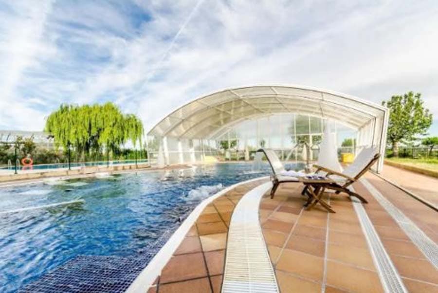 This exclusive 4-star hotel complex represents an exceptional investment opportunity within the Spanish hospitality sector. Situated in a privileged natural setting beside the river and just a few minutes from the historic centre of Salamanca, the asset combines hotel accommodation, wellness, golf, gastronomy, conferences and large-scale events within a single complex offering enormous profitability and repositioning potential.With more than two hundred spacious and fully equipped rooms, including numerous junior suites, the hotel has long been regarded as one of the landmark hospitality establishments in Salamanca and the wider Castile and León region. The rooms include amenities such as minibar, television, fully fitted bathrooms and digital safes, providing comfort and functionality for both leisure and corporate guests.The property particularly stands out for the scale and versatility of its facilities, enabling year-round activity through a wide range of business segments including wellness tourism, golf tourism, relaxing short breaks, conferences, corporate events, weddings, private celebrations and international tourism.One of the hotel’s major strengths is its impressive congress and events infrastructure, positioning it as one of the province’s leading venues for large-scale celebrations and MICE activity:Congress Centre with capacity for approximately 1,200 guests. Auditorium with seating for 415 attendees. 9 fully equipped meeting rooms.  Modern marquee for weddings and celebrations. Extensive landscaped gardens and outdoor areas for private and corporate events. Restaurant, café and hospitality areas designed to accommodate large volumes of guests. The leisure, wellness and sports facilities further enhance the appeal of the complex, making it a highly attractive destination for premium tourism and luxury relaxation breaks:Spa and wellness centre of approximately 1,000 m². Thermal circuit and jacuzzi. Massage and treatment rooms. Heated swimming pools. Outdoor swimming pool and solarium. Gymnasium. Nightclub and leisure areas. Adjacent golf course featuring both 18-hole and 9-hole layouts. All of this is complemented by extensive outdoor areas, a privileged natural setting, free outdoor parking, covered indoor parking and excellent connections to Salamanca city centre and the region’s main transport routes.Visually, the hotel retains an elegant traditional Castilian style with a distinguished and stately character, giving the asset a unique identity and clearly differentiating it from more standardised modern hotel developments. Its peaceful green surroundings further enhance its appeal for guests seeking privacy, relaxation and exclusivity.From an investment perspective, one of the most significant aspects of this opportunity is that hotel groups have already expressed interest in operating the establishment under annual lease agreements, with projected rental income of approximately €700,000 per annum. This makes the asset particularly attractive for property funds, family offices, SOCIMIs, hotel operators and investment groups seeking a combination of stability, immediate recurring income and long-term capital appreciation potential.Furthermore, the property offers substantial scope for growth and repositioning in areas such as:wellness and health tourism, golf tourism, premium weddings and celebrations, MICE conferences and events, international tourism, luxury relaxation breaks, and high-end experiential hospitality operations.  Hotel assets of this scale, with such a combination of facilities, event capacity, strategic location and operational potential, are becoming increasingly rare within the Spanish market, particularly in internationally recognised historic and university cities such as Salamanca.