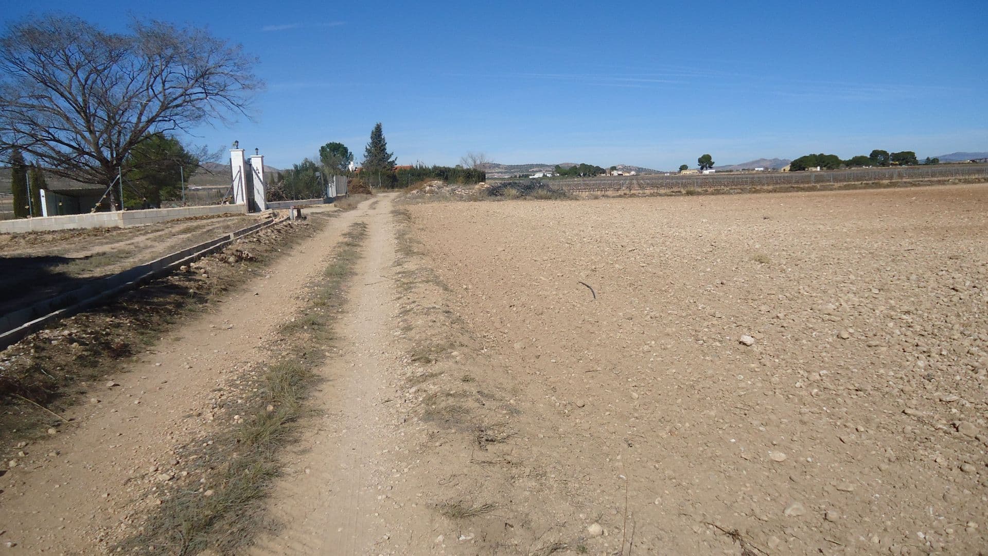 This 27,195m² property offers a great opportunity for development. It includes five water shares and a dedicated irrigation point, ensuring a reliable water supply. The land borders two public roads, with paved access reaching almost to the property. Conveniently located near the highway, it provides easy connectivity while maintaining a peaceful setting. As a buildable plot, it is well-suited for various projects.If you liked this property, do not hesitate to contact us to organize a visit, we will be happy to help you!