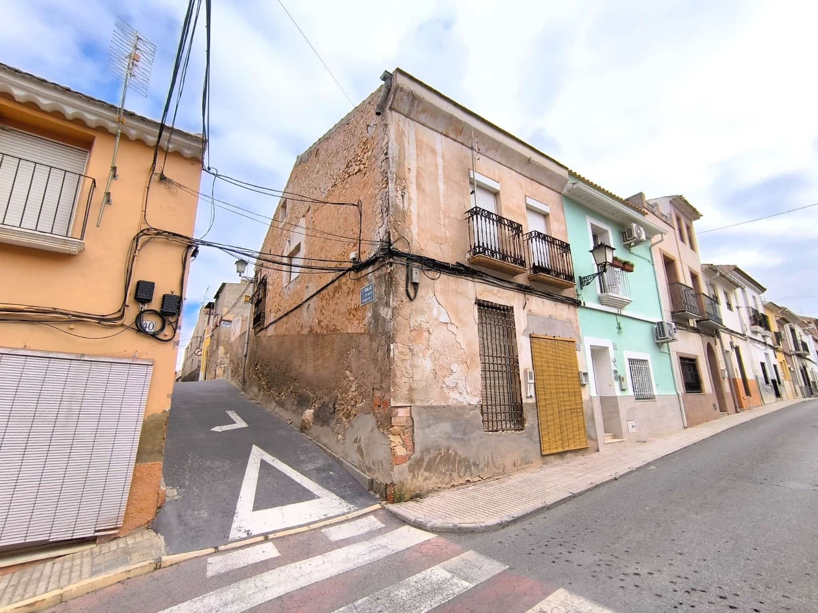 Townhouse to Reform in Prime Location – Excellent Investment Opportunity!This spacious traditional townhouse in need of renovation is located just a short stroll from the heart of Pinoso, offering an unbeatable location within walking distance to all daily amenities including shops, cafes, schools, culture, and medical services.Set across two floors with an attic, this property, built in traditional style, offers a wealth of potential for transformation into a stunning family home or boutique accommodation.On the ground floor, you'll find a welcoming entrance hall, a kitchen, bathroom, and living room, a separate office room and storage area. Upstairs there is a large hallway leading to two bedrooms, a spacious bedroom/salon, with charming little balconies. Beautiful feature staircase adding character and styleTo the rear of the property, there's a private patio with a second bathroom and storage space, plus a gallery above with independent access from another street. The house could accommodate 2 separate apartments, studio, or guest space. Upstairs, the attic provides even more storage or conversion potential.The house is connected to mains water, electricity, and sewer. The walls and floors are structurally sound, the roof was reformed, the rest require a reform - an excellent opportunity to customize a large, traditional home in a vibrant Spanish town.Don't miss this chance to invest in a property full of charm and potential, in a great location at a great price!About the area: Pinoso (Alicante, Spain), known for its stunning countryside, and welcoming atmosphere, offers a perfect blend of traditional Spanish culture and modern conveniences. Surrounded by picturesque vineyards and rolling hills, Pinoso is renowned for its quality of life, with excellent local amenities, schools, and easy access to both the vibrant cities of Alicante and Elche, as well as beautiful Mediterranean beaches. Whether you're seeking a peaceful rural retreat or a family-friendly community, Pinoso is an ideal place to invest in property, combining serene living with great potential for growth.About us: We have a large portfolio of properties in the Costa Blanca and Costa Calida areas, specialising in country properties, villas, fincas, building plots and design and build options in the Alicante and Murcia regions with a particular emphasis on Elda, Monovar, Pinoso, Sax, Villena, Aspe, Fortuna, Albacete and many more surrounding areas. We have been established since 2004 and have decades of experience between the team which we bring to bear to help you find and secure your new dream home. We help you every step of the way to make sure your purchase in Spain is safe and hassle free. We are not here to sell you a property, we are here to help you realise your dream and find what is right for you. With us you are in the safest hands. Contact us now to have a no obligation chat about how you too can realise your dreams.