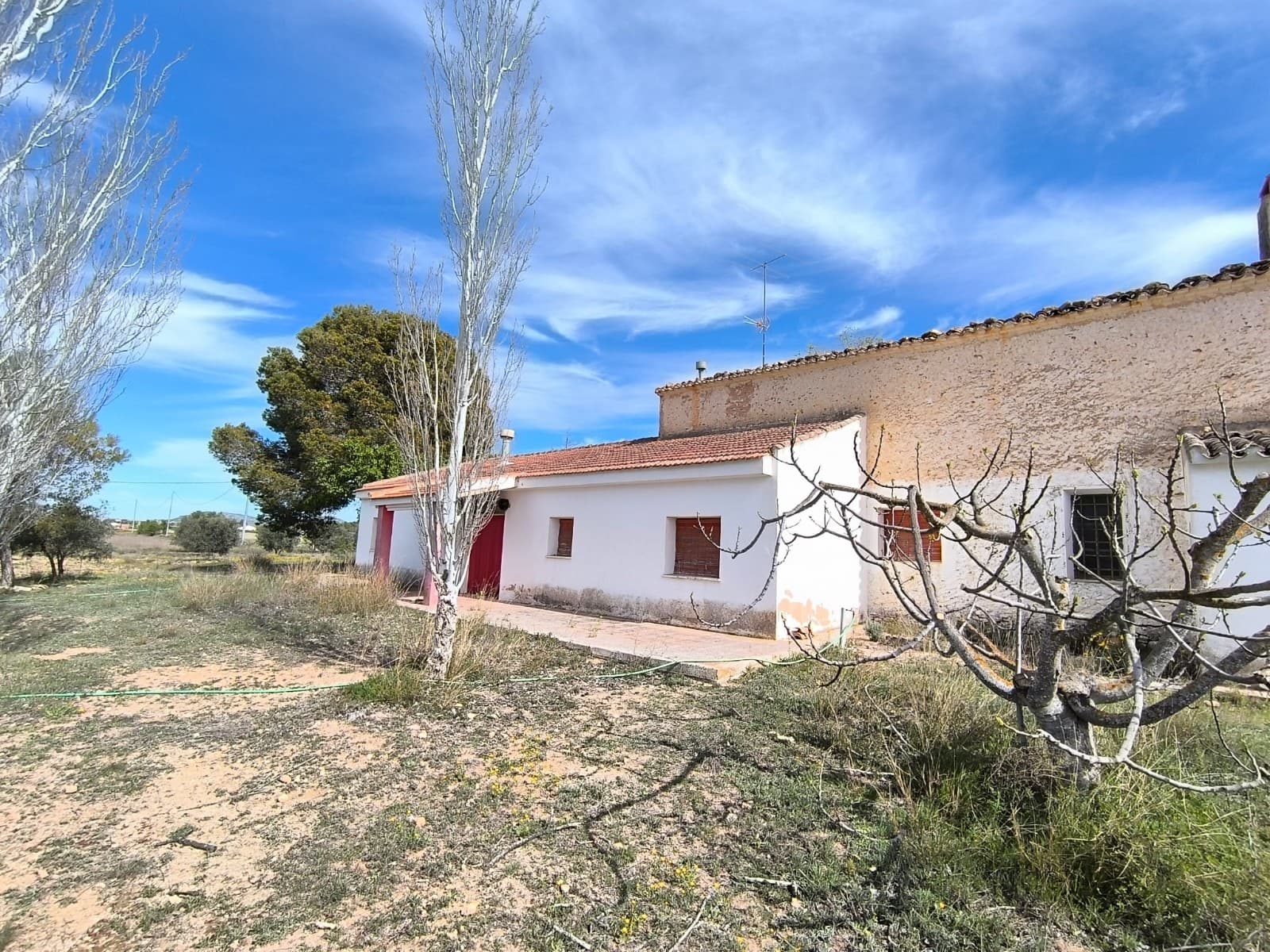 A unique opportunity to acquire a fully equipped rural estate with diverse land types, abundant water resources, and agricultural machinery included.The property spans a total of over 94 hectares, distributed as follows: 36.66 ha irrigated land (regadío)  5.11 ha dryland (secano)  51.24 ha of mountain (buildable)2 ha of irrigated olive treesThe land is split into non-adjacent parcels, all within a walking distance from each other, all accessible.The estate features two houses:Detached country house featuring 5 bedrooms, 2 living rooms, kitchen, bathroom, two independent entrances, swimming pool, 3 garages, sizeable storage. This property includes the private well and the large water reservoir. A second house is an end-terrace house to restore completely, 230 m2 built, 3 bedrooms, storages, patio, garage. It has an access to a shared well.Water rights are a major highlight, including:private well (90 m³/day capacity) and a 330 m³ irrigation reservoir (balsa) 19.5 shares in the Hoya well (with value of approx. €1,100/share)  25 shares in the Cabezuelas well (approx. €2,900/share) The sale also includes a full range of farming equipment: Tractors: Barreiros and John Deere 1640  5,000 kg trailer  Small and large ploughs Inter-row cultivator, leveller, roller with cart, ridger,  Additional tools and equipment.This is an ideal investment for agricultural use, offering infrastructure, machinery, and significant water access in one complete package. All in area with a fertile, mostly flat land, ideal for growing nuts (almonds, walnuts, pistachios), fruits (pears, peaches, apricots, pomegranates, cherries), vine, olives, or vegetables (tomatoes, peppers, melons, watermelons, carrots, artichokes etc.), also for keeping animals (dogs, horses, cattle, goats, sheep).There's also huge potential in further development. Most of the parcels included in the sale are buildable!Ask us for a walkthrough video of the properties and the map of the parcels.About the area: Yecla is a charming and historic town of app. 35000 inhabitants, located in the region of Murcia. It is renowned for its award-winning wines, historical landmarks, and vibrant local culture. The surrounding natural landscapes of scenic mountains, vineyards and almond groves provide opportunities for outdoor activities, while the town itself offers all necessary services, including hospital, schools, shops, restaurants, and other services. With a friendly local community, lively markets, excellent gastronomy, and easy access to nature, Yecla is an ideal location for those seeking authentic Spanish lifestyle - just about an hour from the coast and Alicante airport.About us: We have a large portfolio of properties in the Costa Blanca and Costa Calida areas, specialising in country properties, villas, fincas, building plots and design and build options in the Alicante and Murcia regions with a particular emphasis on Yecla, Novelda, Elda, Monovar, Pinoso, Sax, Villena, Aspe, Fortuna, Jumilla, Abanilla, and many more surrounding areas. We have been established since 2004 and have decades of experience between the team which we bring to bear to help you find and secure your new dream home. We help you every step of the way to make sure your purchase in Spain is safe and hassle free. We are not here to sell you a property, we are here to help you realise your dream and find what is right for you. With us you are in the safest hands. Contact us now to have a no obligation chat about how you too can realise your dreams.