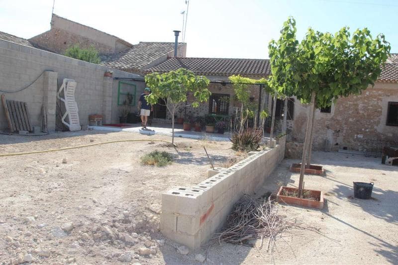 Tastefully restored semi-detached village house only a few minutes from the town of Pinoso. This House has lot of original features and has been restored very sympathetically. It offers a front patio of approx 220m2 (walled and fenced), a house of approx 120m2 and a further casita of approx 40m2. All set on a walled plot of approx 1,000m2. The main house offers 3 bedrooms and 2 bathrooms, lounge, dining room, kitchen. Whilst the casita offers a bedroom, bathroom and large storage area / shed which could be converted into a lounge / kitchen for the casita.The property has all the mains facilities including: water, electric, telephone, internet and tarmac access.We are specialists in the Costa Blanca and Costa Calida specialising in the Alicante and Murcia Inland regions with a particular emphasis on Elda, Pinoso, Aspe, Elche and surrounding areas. We are an established, well known and trusted company that has built a solid reputation amongst buyers and sellers since we began trading in 2004. We offer a complete service with no hidden charges or surprises, starting with sourcing the property, right through to completion, and an unrivalled after sales service which includes property management, building services, and general help and advice to make your new house a home. With a portfolio of well over 1400 properties for sale, we are confident that we can help, so just let us know your preferred property, budget and location, and we will do the rest.