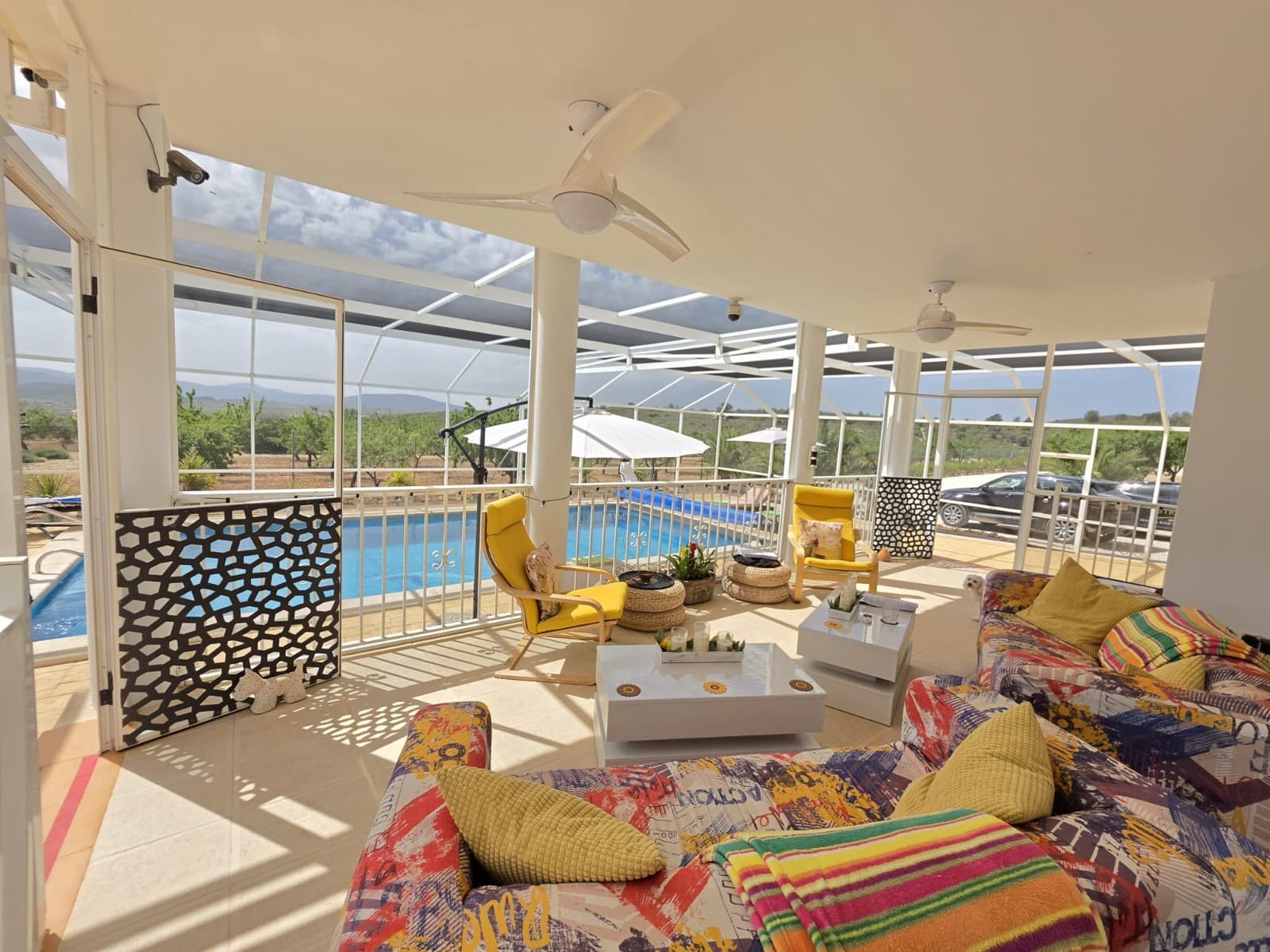 Spacious Villa with Heated Pool and Solar System in Lel, PinosoThis well-equipped villa is located in the peaceful area of Lel, near Pinoso, offering space, privacy, and a comfortable lifestyle in the countryside. The property currently features three bedrooms, all with ensuite bathrooms, and a total of five bathrooms. The home was originally designed as a four-bedroom villa and can easily be converted back if required.Inside, the villa offers generous living areas, including an extended lounge, two fireplaces, and a combination of ducted air conditioning (hot and cold) and ceiling fans throughout the house for year-round comfort. The property is fitted with fly screens and benefits from an alarm system for added security.The home is powered by mains electricity and supported by a solar system with 15 panels (500W each), helping to improve energy efficiency. Water is supplied via a 25,000-litre deposit, typically refilled every six weeks, providing a reliable and cost-effective solution.Outside, the villa sits on a fully fenced and landscaped plot with electric gates and a covered porch for outdoor living. The standout feature is the 10 x 5 metre heated swimming pool, maintained at approximately 30°C and fully enclosed within a Florida screen, which covers the pool, patio, barbecue area, and children's play area. This creates a comfortable outdoor space protected from flies during harvest season and other insects.The outdoor area is designed for both relaxation and entertaining, featuring a barbecue area with a pizza oven, an outside toilet, and a children's playground with climbing frame. The grounds include an orchard with almond trees and irrigation pipes throughout the plot. A local farmer maintains the land and trees at no cost in exchange for the crops.The garage building is split into a garage space and a workshop, and also includes an upper floor currently used as storage and a dressing room. This building offers further potential and could be converted into a self-contained guest annexe if desired.The property is set in a quiet area with complete privacy and enjoys open views across the valley, vineyards, and orchards. While there are neighbours in the surrounding area, the villa itself remains private and secluded. The entire plot is secure and ideal for walking, outdoor activities, or simply enjoying the natural surroundings.About the Area Lel is a peaceful rural area just a short drive from Pinoso, a lively inland town known for its excellent restaurants, local wines, and welcoming community. Pinoso offers all essential services including supermarkets, schools, and medical facilities, and is less than 10 minutes away. The nearest bar or restaurant is approximately 3–4 km from the property. The surrounding countryside is ideal for walking, hiking, and outdoor living, while Alicante city, the airport, and the coast are all within comfortable driving distance. This location offers a perfect balance of privacy, nature, and convenience.We have a large portfolio of properties in the Costa Blanca and Costa Calida areas, specialising in country properties, villas, fincas, building plots and design and build options in the Alicante and Murcia regions with a particular emphasis on Elda, Monovar, Pinoso, Sax, Villena, Aspe, Fortuna, Albacete and many more surrounding areas. We have been established since 2004 and have decades of experience between the team which we bring to bear to help you find and secure your new dream home. We help you every step of the way to make sure your purchase in Spain is safe and hassle free. We are not here to sell you a property, we are here to help you realise your dream and find what is right for you. With us you are in the safest hands. Contact us now to have a no obligation chat about how you too can realise your dreams.