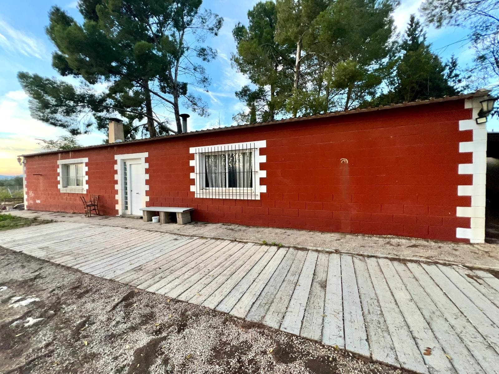 This unique property offers an excellent opportunity for both private living and hosting events, all within a spacious and versatile setting.The estate includes a group of houses and a large warehouse-style building currently used for celebrations and gatherings. This impressive space features a fully equipped bar area, a music booth, and ample room for events and barbecues. It also includes an indoor swimming pool, a kitchen, a generous main hall, and bathroom facilities, making it ideal for private parties, family celebrations, or potential business use.In addition to the event space, the property offers a separate house set on its own plot of land. The home consists of a bright living room with an open-plan kitchen and fireplace, one bathroom, and two comfortable bedrooms. The surrounding land provides outdoor space for gardening, recreation, or further development, depending on your needs.Located in a quiet and accessible area, the property enjoys privacy while still being within easy reach of local services and main roads. The surroundings offer a peaceful atmosphere, making it suitable for both residential living and hosting social events. This is a versatile property with significant potential for personal use or investment.We have a large portfolio of properties in the Costa Blanca and Costa Calida areas, specialising in country properties, villas, fincas, building plots and design and build options in the Alicante and Murcia regions with a particular emphasis on Elda, Monovar, Pinoso, Sax, Villena, Aspe, Fortuna, Albacete and many more surrounding areas. We have been established since 2004 and have decades of experience between the team which we bring to bear to help you find and secure your new dream home. We help you every step of the way to make sure your purchase in Spain is safe and hassle free. We are not here to sell you a property, we are here to help you realise your dream and find what is right for you. With us you are in the safest hands. Contact us now to have a no obligation chat about how you too can realise your dreams.