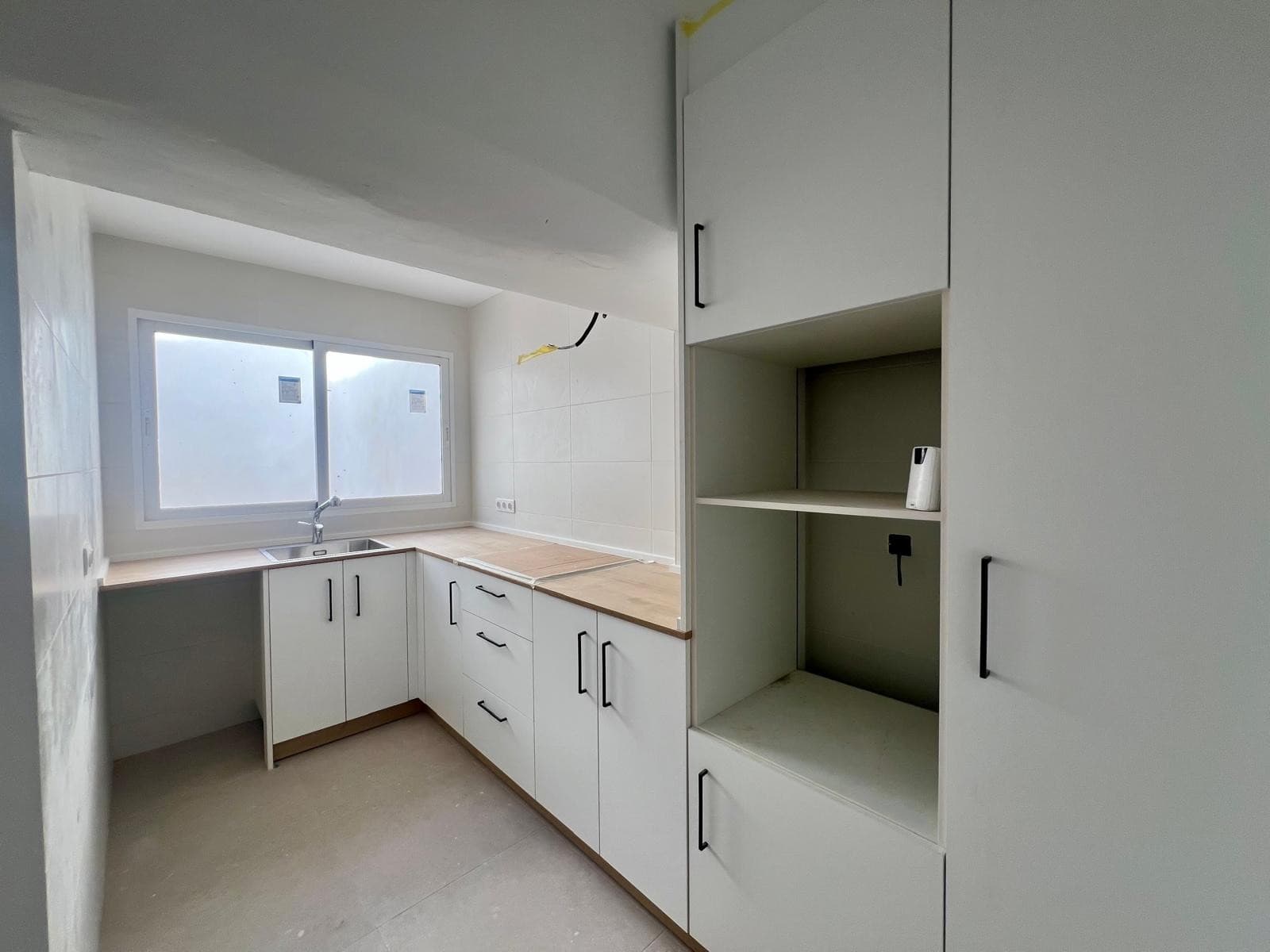 Fully renovated two-storey terraced house, located in one of the most central and established areas of Pinoso, just a one-minute walk from the iconic Clock Tower.The property offers 115 m² of built area and has been completely refurbished using modern materials and a high standard of finish. It is ready to move into.LayoutGround floor: Bright living room with fireplace One bedroom Fully renovated independent kitchen, equipped with sink, ceramic hob, and 80-litre electric water heater Utility / gallery area Full bathroom with walk-in shower Direct access to a large, fully usable private patio, ideal for outdoor dining, leisure, or creating a comfortable seating area First floor: Two bedrooms Second full bathroom with shower, offering a practical and well-balanced layout Features & RenovationThe renovation includes: White aluminium windows White interior doors Grey porcelain flooring Smooth walls Fully updated plumbing and electrical installations The house has been carefully finished throughout, offering comfort, functionality, and a modern feel.LocationSituated in the heart of Pinoso, the property enjoys immediate access to all local services, including shops, restaurants, schools, and key points of interest. Pinoso is a well-connected town with a welcoming community and a calm atmosphere, making this home ideal as a permanent residence, holiday home, or investment.We have a large portfolio of properties in the Costa Blanca and Costa Calida areas, specialising in country properties, villas, fincas, building plots and design and build options in the Alicante and Murcia regions with a particular emphasis on Elda, Monovar, Pinoso, Sax, Villena, Aspe, Fortuna, Albacete and many more surrounding areas. We have been established since 2004 and have decades of experience between the team which we bring to bear to help you find and secure your new dream home. We help you every step of the way to make sure your purchase in Spain is safe and hassle free. We are not here to sell you a property, we are here to help you realise your dream and find what is right for you. With us you are in the safest hands. Contact us now to have a no obligation chat about how you too can realise your dreams.