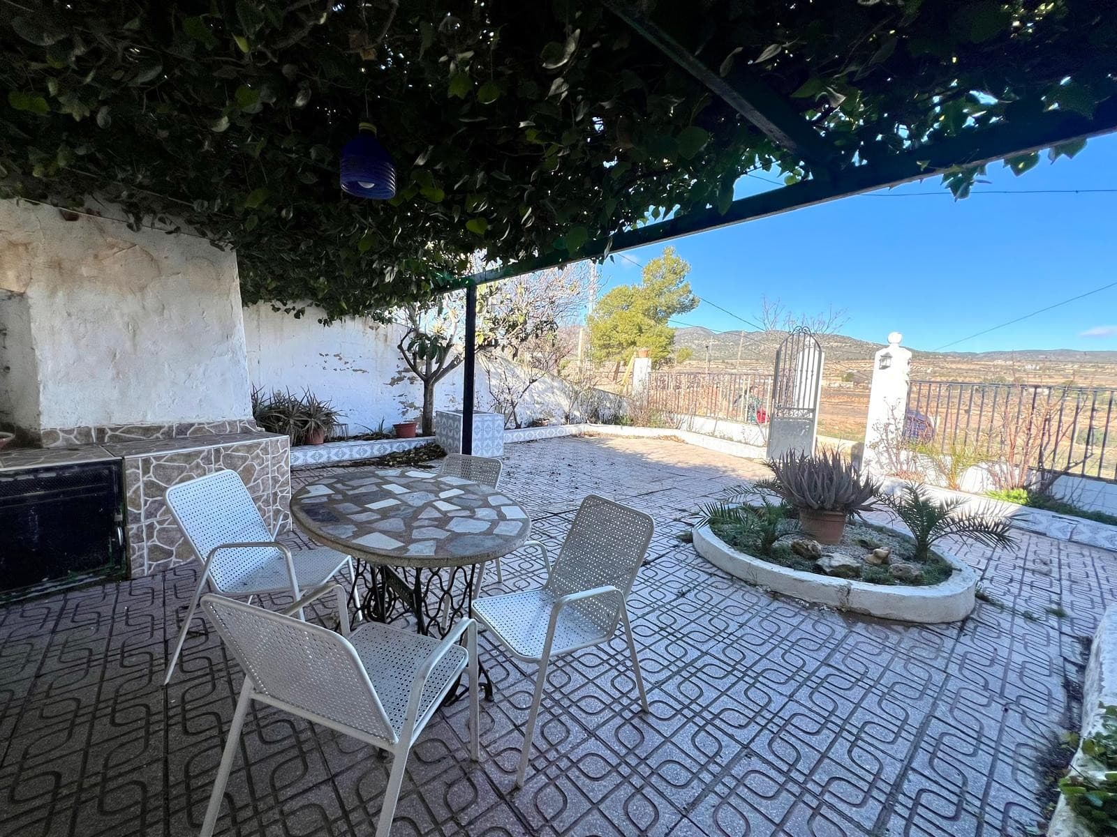 Discover the unique appeal of this spacious cave house located just outside Pinoso. Set on a nearly 670m² fenced plot, this property offers privacy, comfort, and great outdoor spaces.Inside, you'll find four bedrooms and two bathrooms, along with a cozy living room featuring a fireplace—perfect for year-round comfort. The home also includes a beautiful courtyard with space for a small garden, ideal for relaxing outdoors.A second courtyard, connected to the garage, features a built-in BBQ area, making it a great spot for entertaining. Additionally, there's a carport for extra parking. The property enjoys wonderful views, adding to its charm.If you liked this property, do not hesitate to contact us to organize a visit, we will be happy to help you!