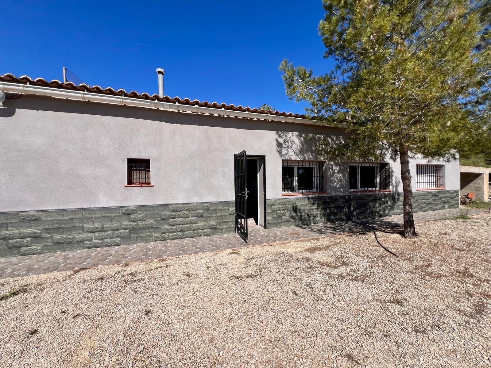 Discover this unique cave house just minutes from Barinas, Murcia, set in a peaceful natural environment with breath taking open views over the surrounding countryside.The main living area impresses with its generous proportions and abundant natural light. Upon entering, you are welcomed by a spacious open-plan living and dining area with a equipped kitchen, all enhanced by large windows that flood the space with sunlight throughout the day, creating a warm and inviting atmosphere.The property also features a bathroom, a practical storage room, solar panels, and a water deposit, offering energy efficiency and a degree of self-sufficiency, perfect for those seeking a more sustainable lifestyle.From the bright and comfortable living room, you access the cave area, an exceptional and character-filled space. This unique part of the property includes a cosy room with a fireplace and three additional rooms, all naturally maintaining a pleasant temperature year-round. Whether used as extra bedrooms, a home office, a creative studio, or a relaxation area, the possibilities are endless.About the locationSituated in a tranquil setting just a short drive from Barinas (Abanilla), this property enjoys the best of both worlds: privacy, nature, and convenience. The area is known for its stunning open landscapes, sunny Mediterranean climate, and laid-back lifestyle. Essential services, local shops, and connections to nearby towns are all within easy reach, making it an ideal choice for a permanent residence, holiday home, or investment.If you liked this property, do not hesitate to contact us to organize a visit, we will be happy to help you!We have a large portfolio of properties in the Costa Blanca and Costa Calida areas, specialising in country properties, villas, fincas, building plots and design and build options in the Alicante and Murcia regions with a particular emphasis on Elda, Monovar, Pinoso, Sax, Villena, Aspe, Fortuna, Albacete and many more surrounding areas. We have been established since 2004 and have decades of experience between the team which we bring to bear to help you find and secure your new dream home. We help you every step of the way to make sure your purchase in Spain is safe and hassle free. We are not here to sell you a property, we are here to help you realise your dream and find what is right for you. With us you are in the safest hands. Contact us now to have a no obligation chat about how you too can realise your dreams.