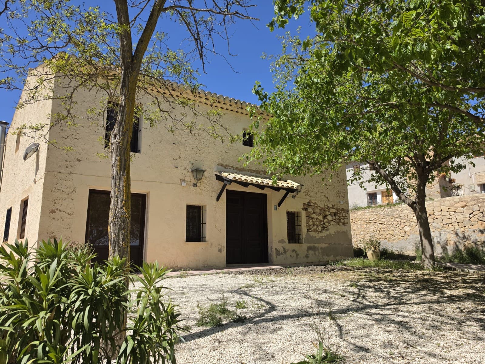 Character Country House with Original Features Near MonóvarThis charming country house is located in a small village near Monóvar, offering a peaceful setting with beautiful open views and plenty of character throughout. The property features five bedrooms and two bathrooms, making it suitable for family living or as a spacious holiday home.Inside, the house retains many original features, including exposed wooden beams, flagstone floors, and handmade clay tiles, giving the property a warm and authentic feel. There are two open fireplaces that add both comfort and atmosphere, along with central heating for year-round living. The home has been tastefully decorated with antique furniture, enhancing its traditional style while remaining practical and welcoming.Outside, the property includes a small garden area with mature trees, providing shade and a pleasant space to relax. There are also two barbecue areas, ideal for outdoor dining and entertaining while enjoying the surrounding views.The house is connected to mains water and electricity, ensuring convenience while still offering the charm of rural living.About the AreaThe property is situated in a small village close to Monóvar, a traditional inland town known for its vineyards, local markets, and relaxed lifestyle. The area is surrounded by countryside, offering a quiet and natural environment, while still being within easy reach of everyday services such as shops, restaurants, and schools. Alicante city, the airport, and the coast can be reached within a comfortable drive, making this location ideal for those looking to combine rural living with good connections.We have a large portfolio of properties in the Costa Blanca and Costa Calida areas, specialising in country properties, villas, fincas, building plots and design and build options in the Alicante and Murcia regions with a particular emphasis on Elda, Monovar, Pinoso, Sax, Villena, Aspe, Fortuna, Albacete and many more surrounding areas. We have been established since 2004 and have decades of experience between the team which we bring to bear to help you find and secure your new dream home. We help you every step of the way to make sure your purchase in Spain is safe and hassle free. We are not here to sell you a property, we are here to help you realise your dream and find what is right for you. With us you are in the safest hands. Contact us now to have a no obligation chat about how you too can realise your dreams.