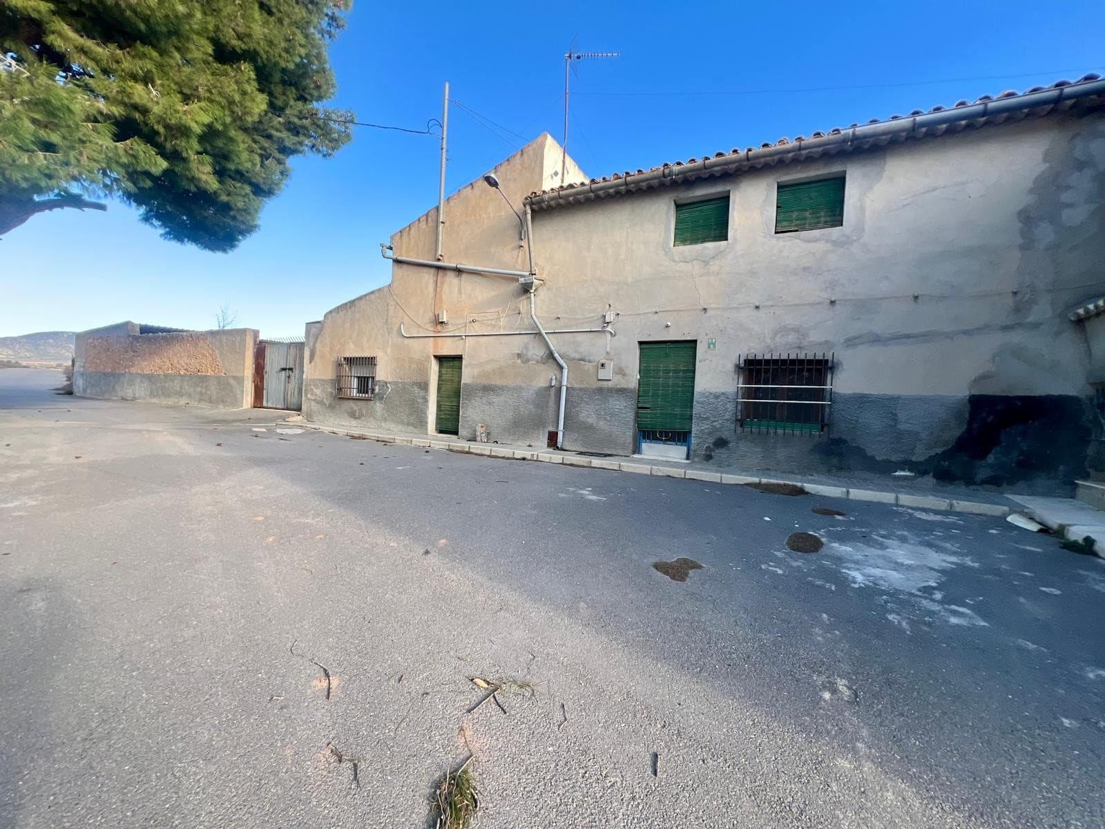 If you are looking for a country home with space, privacy, and beautiful open views, this property in Fuente del Pino could be exactly what you have been searching for.Set in a peaceful rural location surrounded by nature, this charming home offers the perfect balance between countryside living and everyday convenience. All essential amenities are within easy reach, and the town of Pinoso is just an 8-minute drive away.The property retains the character of a traditional Spanish country house and offers a practical and comfortable layout. The ground floor features a living room, a cosy sitting room with a fireplace, a kitchen, two bedrooms, a family bathroom, a garage, and a large courtyard or garden area with plenty of space to enjoy outdoor living, create a leisure area, install a swimming pool, or cultivate a vegetable garden.On the first floor, there are two additional bedrooms and a traditional hayloft, offering further storage space or exciting possibilities for renovation and conversion to suit your needs.The property benefits from mains electricity, irrigation water, and a well, all valuable features for those looking to enjoy country living. Surrounding the house are approximately 8,300 m² of land, providing privacy, space, and a wide range of potential uses.The house is semi-detached to a neighbouring property, which is also available for sale. There is the opportunity to purchase both houses together, along with the surrounding plots, making this an attractive option for extended families, rural tourism projects, or buyers seeking a larger investment opportunity.About the AreaFuente del Pino is a small and peaceful hamlet within the municipality of Monóvar, known for its beautiful countryside, open landscapes, and relaxed lifestyle. The area offers the tranquillity of rural Spain while remaining close to the amenities of nearby towns such as Pinoso and Monóvar. It is an ideal location for those seeking space, nature, and a slower pace of life without feeling isolated.If you liked this property, do not hesitate to contact us to organize a visit, we will be happy to help you!We have a large portfolio of properties in the Costa Blanca and Costa Calida areas, specialising in country properties, villas, fincas, building plots and design and build options in the Alicante and Murcia regions with a particular emphasis on Elda, Monovar, Pinoso, Sax, Villena, Aspe, Fortuna, Albacete and many more surrounding areas. We have been established since 2004 and have decades of experience between the team which we bring to bear to help you find and secure your new dream home. We help you every step of the way to make sure your purchase in Spain is safe and hassle free. We are not here to sell you a property, we are here to help you realise your dream and find what is right for you. With us you are in the safest hands. Contact us now to have a no obligation chat about how you too can realise your dreams.