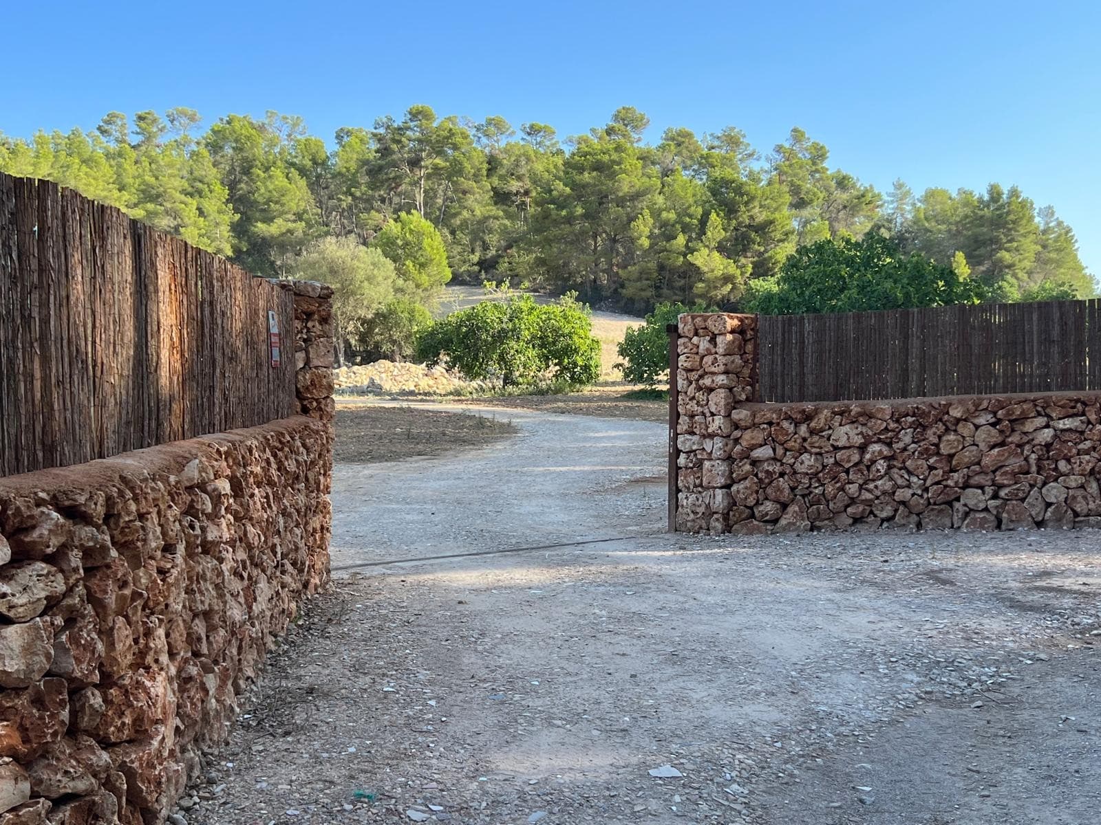 Exceptional Building Plot with Project in the Heart of MallorcaThis unique finca plot offers a rare opportunity to create a private countryside estate in one of Mallorca's most peaceful and authentic locations, close to the charming town of Porreres. Set on an impressive 23,285 m² plot, this property combines privacy, nature, and development potential, making it ideal for a luxury rural home, horse property, or self-sufficient lifestyle project.A major advantage of this property is that it already comes with an approved building permit (basic project) for two buildings. In addition, the property previously had permission to drill a deep well, which can be applied for again and should not present any major difficulties.The current approved plans allow for: A two-storey main residence of 186 m²  A 25 m² covered terrace  A 90 m² semi-open utility building, suitable for use as a carport, stable, or agricultural space Thanks to the generous plot size, there is potential to expand the total living area up to approximately 350 m² (subject to final project approvals).The land itself is fertile and beautifully natural, featuring mature fig, almond, walnut, carob, and citrus trees, along with a private section of pine forest. The property is especially suited to horse keeping, as it previously held a REGA permit, which can be reapplied for and is expected to be straightforward to obtain again. Riding and hiking routes begin directly from the property.The finca is largely fenced and accessed through a substantial Mallorcan natural stone entrance wall with a rustic iron gate. The former ruin on the land has already been removed in line with planning conditions, and approximately 300-year-old original natural stones remain on site, offering the possibility to incorporate authentic Mallorcan character into the future build.Electricity is available nearby but not yet connected, making this an excellent opportunity for a solar-powered or fully autonomous lifestyle.About the Area Located in the heart of Mallorca near Porreres, this property enjoys a rare balance of complete rural tranquility and excellent accessibility. There are no direct neighbours, roads, or high-voltage lines disturbing the natural setting, while Palma airport, the city, and Mallorca's beaches are all within approximately 30 minutes. Porreres itself is a traditional Mallorcan town with local shops, restaurants, and services, known for its authentic atmosphere and central location. This area is highly sought after for those looking to enjoy genuine island living, privacy, and long-term value.