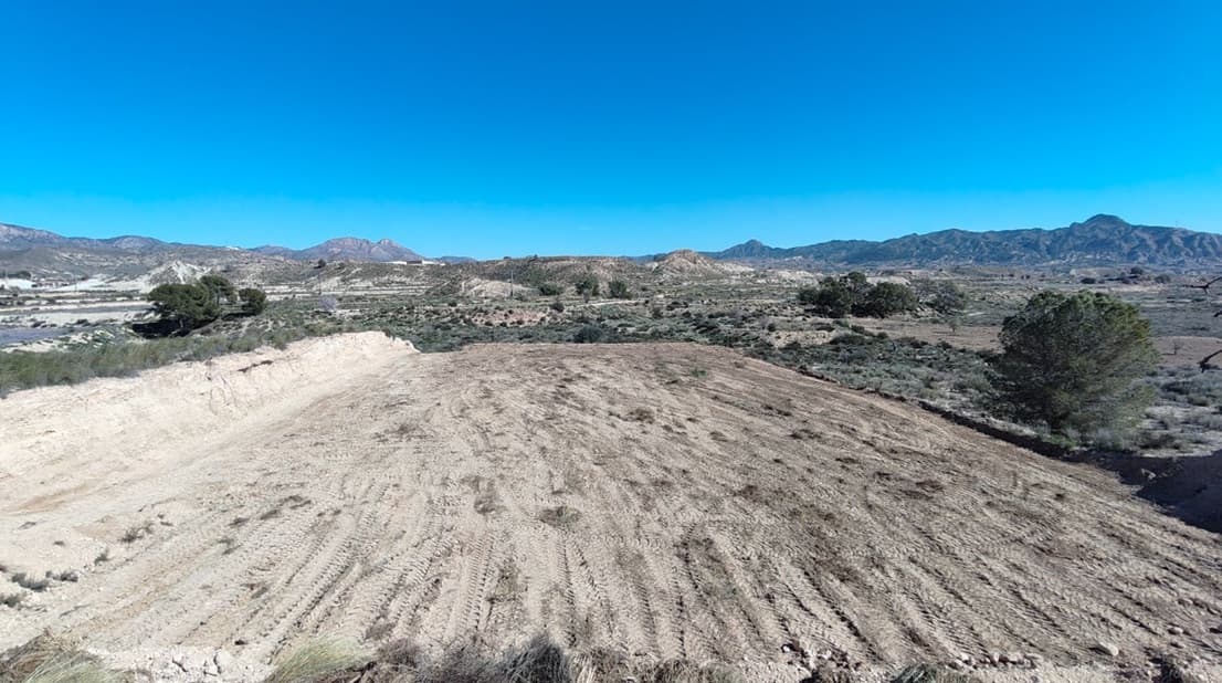 Presenting you this bargain legal building plot in tranquil setting north of Abanilla! The plot is prepared for your dreams to come true - you can build up to 250 m2 on one level (or 200 m2 on 2 levels). Mains drinking water connected. The terrain is flattened, cleaned, so you can start building and planting immediately. It offers breath-taking views, in a calm rural area.Main tarmac road - 200 mMahoya (the closest village) - 3 kmAbanilla (the closest town with all the daily amenities) - 8 min driveMurcia (the closest city) - 30 minAlicante airport - 45 minBeach - 45 minAbout the Area: Abanilla is a charming Spanish town known for its rich history, traditional architecture, and peaceful Mediterranean lifestyle. Surrounded by olive groves, and scenic mountain views, Abanilla offers a tranquil rural atmosphere just 30 minutes from the beaches of the Costa Blanca and the city of Murcia. The area boasts a welcoming community, excellent local amenities, and affordable property prices—ideal for those seeking an authentic Spanish experience, whether for a holiday home, retirement, or investment opportunity.About us: We have a large portfolio of properties in the Costa Blanca and Costa Calida areas, specialising in country properties, villas, fincas, building plots and design and build options in the Alicante and Murcia regions with a particular emphasis on Elda, Monovar, Pinoso, Sax, Villena, Aspe, Fortuna, Albacete and many more surrounding areas. We have been established since 2004 and have decades of experience between the team which we bring to bear to help you find and secure your new dream home. We help you every step of the way to make sure your purchase in Spain is safe and hassle free. We are not here to sell you a property, we are here to help you realise your dream and find what is right for you. With us you are in the safest hands. Contact us now to have a no obligation chat about how you too can realise your dreams.