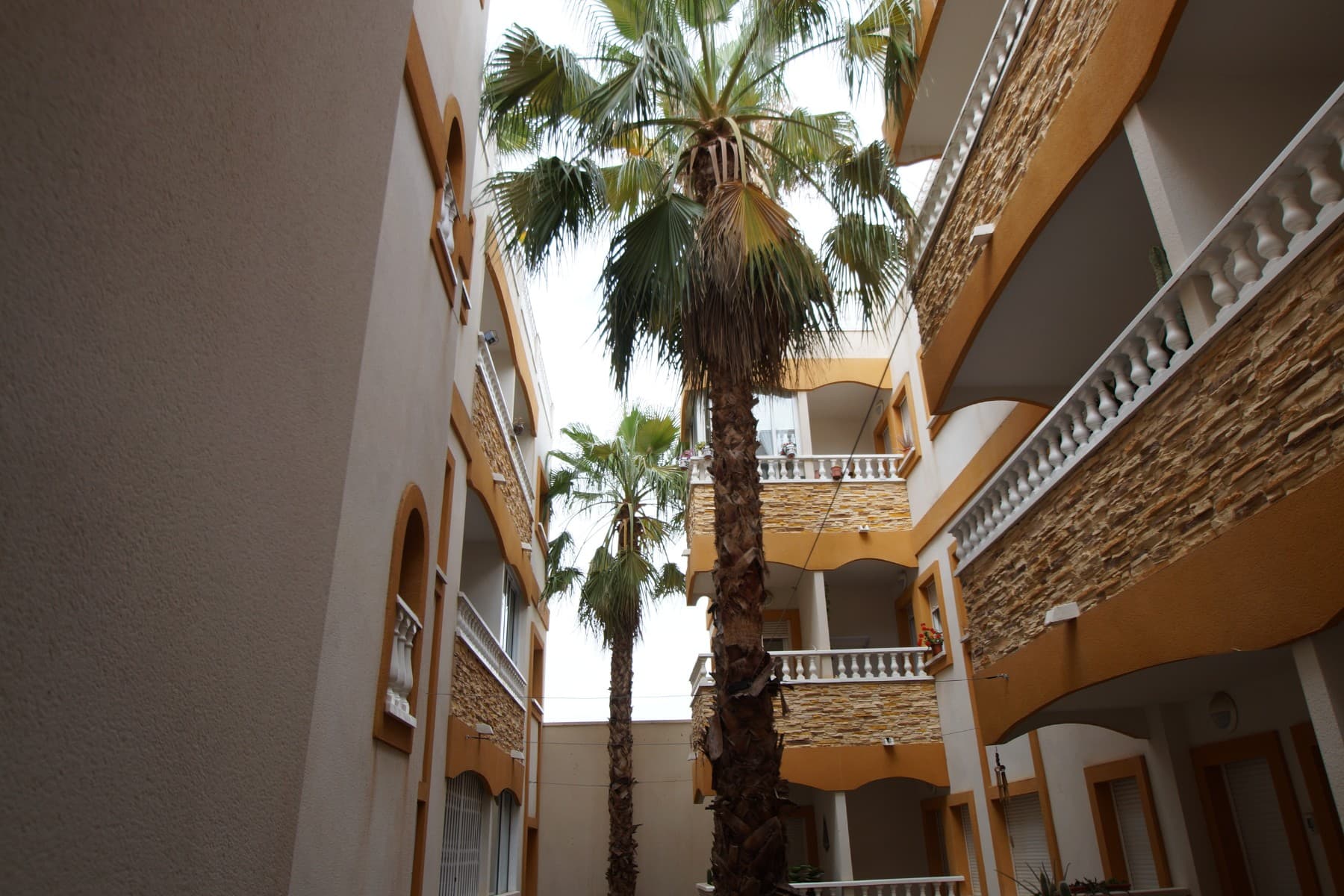 Nice apartment on 1st floor in a quiet but comfortable village to live as on holiday both throughout the year.It has 2 bedrooms and 1 bathroom. One bedroom is double, has a large wardrobe and another is for guests.The open kitchen comes fully equipped with appliances.Living-dining room gives access to the terrace from which the beautiful views of the green areas open.It is delivered fully furnished, equipped and ready to move into. Good general condition.In the solarium there is a large open space, barbecue, plants, spectacular view of the local villages.Up there is also the communal pool.The building has a lift and well-maintained common areas.Recommended to visit.