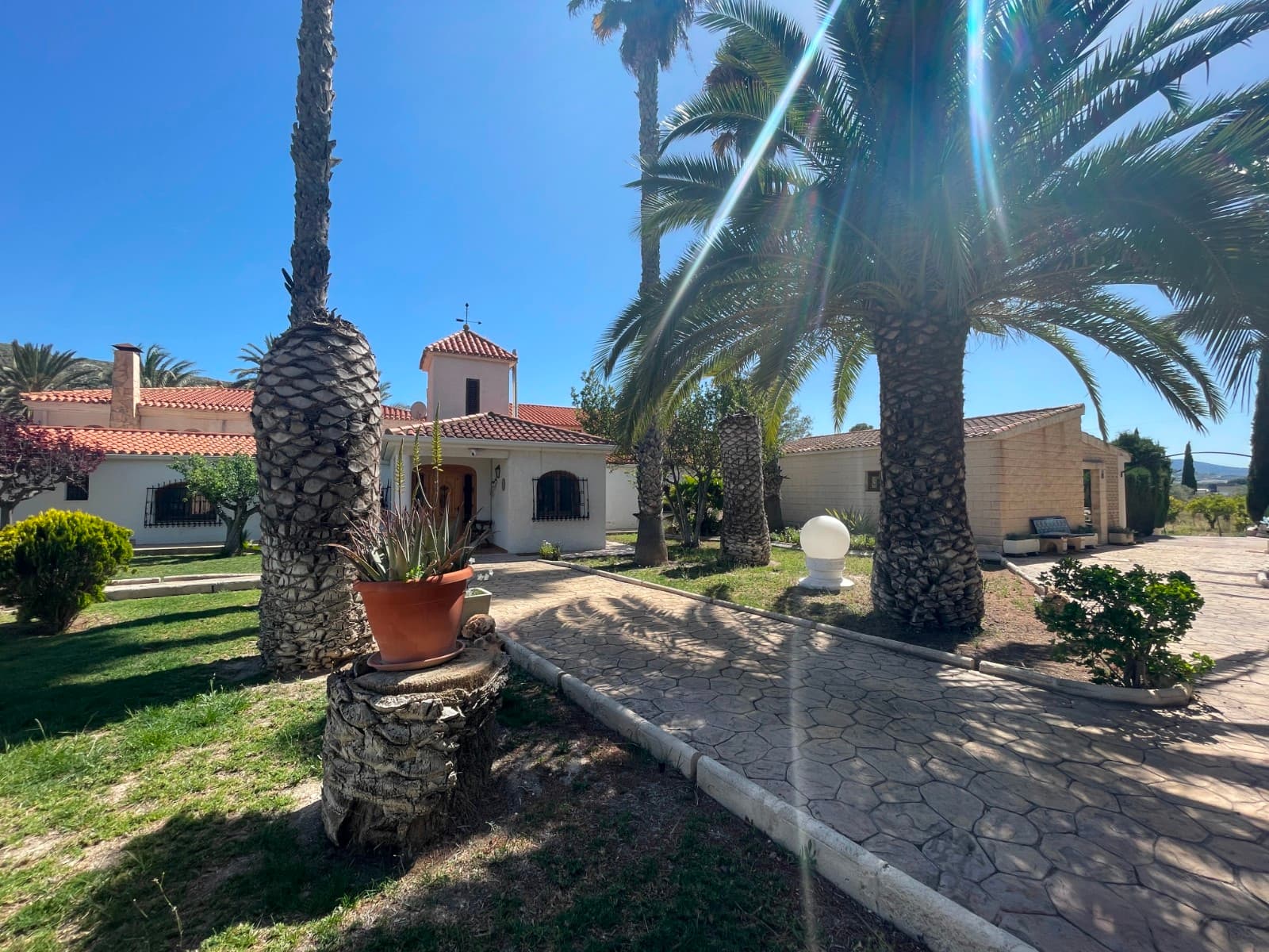 In the heart of the Costa Blanca, in Elda, lies this impressive estate of 21,218 m² of land, a unique property with enormous potential to be transformed into one of the most exclusive wedding, event, and tourist accommodation complexes in the region.This is a property with a stately character, currently used as a tourist rental (Airbnb-style), combining spaciousness, privacy, and multiple facilities, offering an exceptional base for a high-performance investment project.Main Residence and Accommodation CapacityThe estate offers approximately 13 bedrooms, with the potential—after proper renovation—to accommodate more than 30 guests, making it ideal both for group tourism and boutique hospitality.The property currently features a large and functional layout, although it requires interior renovation and façade updates, allowing the future owner to fully customize the concept of the business.Wedding and Event PotentialThanks to its size, layout, and natural surroundings, this estate is particularly attractive for the events sector:More than 21,000 m² of landSeparate parking area with capacity for approximately 70 additional vehiclesLarge outdoor spaces ideal for ceremonies, celebrations, and banquetsTwo private pools (approximately 62 m² and 52 m²), adding value for events and premium staysIt is clearly designed to become a landmark wedding and event venue on the Costa Blanca.Leisure Facilities and Common AreasThe estate already includes facilities that significantly increase its operational value:88 m² games room equipped with billiards and a barSpacious communal areas for gatherings and celebrationsLandscaped, natural, and versatile outdoor areas for multiple usesLand and EnvironmentThe land combines open spaces with vegetation and cultivated areas, offering total privacy and multiple development possibilities. Its size allows both luxury residential use and commercial or tourism exploitation.Real Investment OpportunityThis property represents an exceptional opportunity to:Convert it into a high-end wedding and event venueDevelop a boutique or rural luxury accommodation businessCombine both business models to maximize profitabilityIts strategic location in the province of Alicante, together with its size and features, positions it as a high-potential asset for both value appreciation and commercial exploitation.LocationElda (Alicante), at:38 km from Alicante city35–40 km from the beachesExcellent access to the airport and main roads  ConclusionA property with soul, scale, and potential.A space that is not only a home purchase, but a business project, an investment, and a lifestyle.The perfect place to create one of the most exclusive event destinations on the Costa Blanca.10 bathrooms13 bedrooms2 swimming pools2 summer kitchensGames and events room3 living roomsIrrigation waterWell waterMains waterBilliardsSauna4 kitchens197 olive treesPomegranate treesAlmond treesPlum treesOrange treesLemon treeCapacity for 20 peoplePerfect for events, weddings and holiday rentalsDog kennelsLakeCastilian style22,000 m² plotParking area for 70 cars