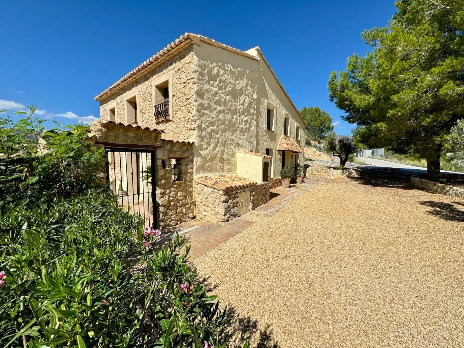 Exclusive finca of unique character set in the natural surroundings of Relleu, designed for those seeking privacy, authenticity, and a sophisticated lifestyle in the heart of the Mediterranean countryside.The property, with 249 m² built, is distributed across two spacious living rooms with wood-burning fireplaces, a fully equipped high-end kitchen, and generous storage spaces where functionality blends seamlessly with design.A refined wine cellar with natural stone walls stands out as an intimate and inviting space, ideal for leisure and social gatherings.The spacious high-ceiling entrance hall leads to a versatile area currently used as a laundry room, with potential for an office or additional bedroom, as well as a guest toilet.The sleeping area offers three large bedrooms, all with en-suite bathrooms and open views of the Mediterranean landscape. The property also includes a separate space currently used as a professional consulting room.Outside, the 7,993 m² plot unfolds across multiple levels and features approximately 50 centuries-old olive trees, a private saltwater swimming pool, spacious terraces with open views, and storage areas.The property is located just 2 km from the center of Relleu, within walking distance, 18 km from the beaches of the Costa Blanca, and 63 km from the international airport.Set in an exceptionally peaceful location, the finca offers an incomparable natural environment surrounded by hills, Mediterranean vegetation, and almond groves.An exceptional property that represents far more than a home: a private high-end retreat where nature, comfort, and lifestyle exist in perfect harmony.