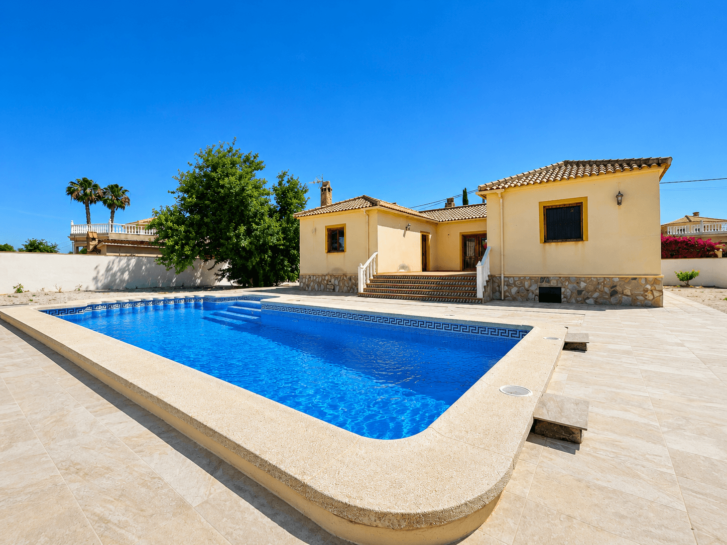 If you are looking for a detached villa with space, privacy, natural light, and comfort, this property offers everything needed to enjoy from day one.The house offers 162 m² built on a fully fenced 2,000 m² plot, combining tranquillity, privacy, and proximity to neighbouring homes.One of its main highlights is the recently renovated 12 x 5 m private swimming pool, equipped with a new motor and renewed surrounding flooring. Next to the pool there is a 21 m² porch with open views and pre-installation for electricity and TV connection, perfect for creating a chill-out area or covered outdoor dining space.Layout & Features4 bedrooms, including 2 double roomsMaster bedroom with en-suite bathroom2 full bathrooms + 1 guest toiletSpacious living-dining room with functional fireplaceIndependent fully equipped kitchenUtility/laundry room with storage spaceThe property benefits from Climalit double-glazed windows throughout.South-facing orientationThe south-facing orientation guarantees natural light all day long.Outdoor areasThe large plot offers endless possibilities: garden, vegetable patch, barbecue area, playground, chill-out zone, or covered garage.Recent upgradesRenovated swimming pool with new motorExterior walls finished with perimeter lightingUpdated drainage system and septic tank connectionMotorised entrance gate controlled via mobile phoneLandscaped rear area with decorative gravel and anti-weed meshNatural stone access pathsNew intercom systemTwo air conditioning units included, ready for installationImportant informationThe property is legally registered and has active electricity supplyThe house is not connected to mains waterThe property requires the installation of an approximately 12,000-litre water tank, a common system used in many homes in the areaThe property does not currently have a habitation certificate or second occupancy certificateHowever, the property is fully registered and local property tax (IBI) has been paid since constructionA property with this level of maintenance, space, and features is hard to find. Contact us today to arrange a viewing.